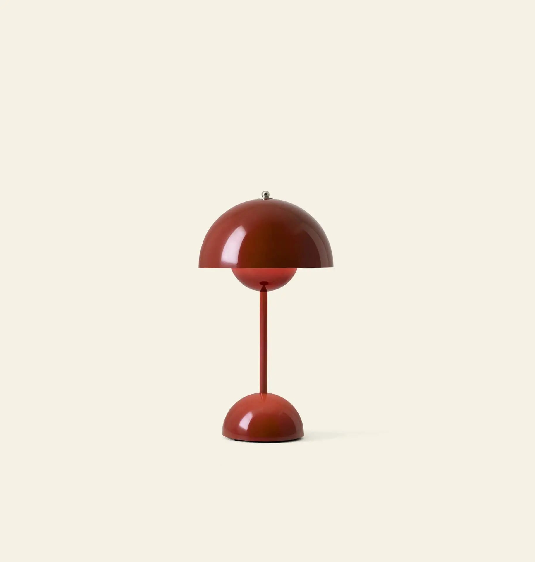 The &Tradition Flowerpot VP9 Portable Table Lamp features a red, dome-shaped, minimalist design with a round base, vertical stem, matching half-sphere shade, and includes a USB charging cable. Set against a plain beige background.