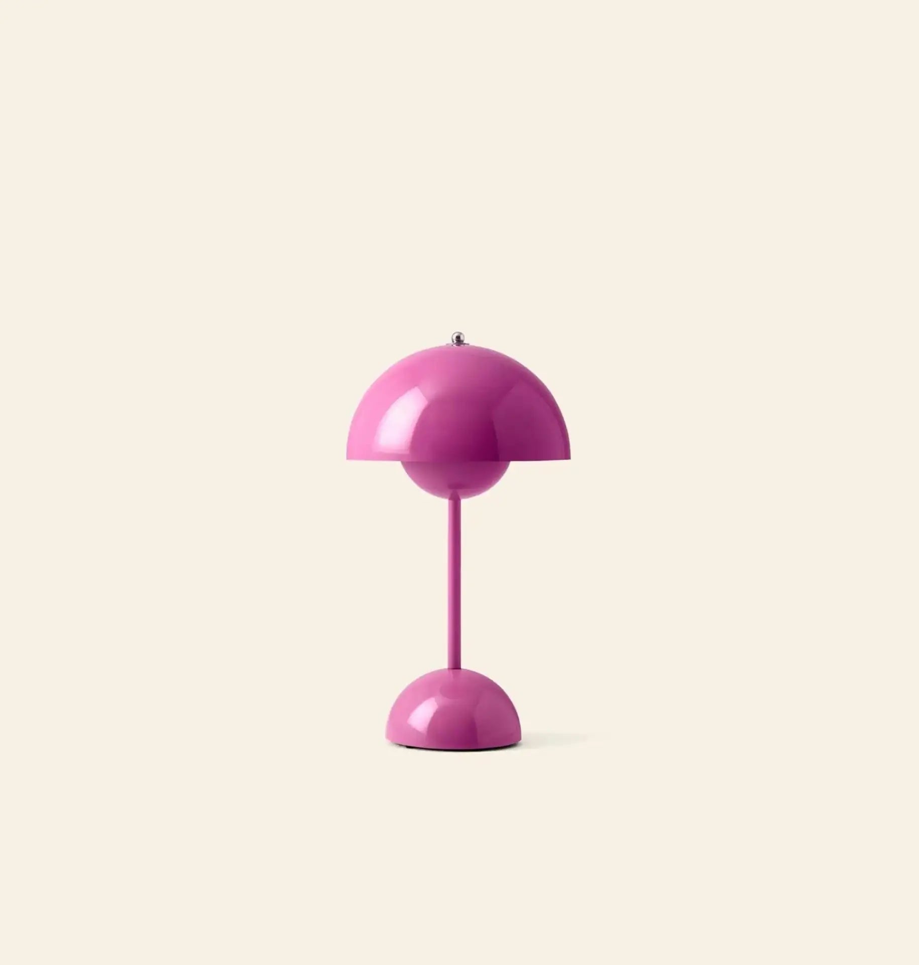 The &Tradition Flowerpot VP9 Portable Table Lamp features a glossy pink dome-shaped shade and matching base, set on a plain beige background. Comes with a USB charging cable for added convenience.
