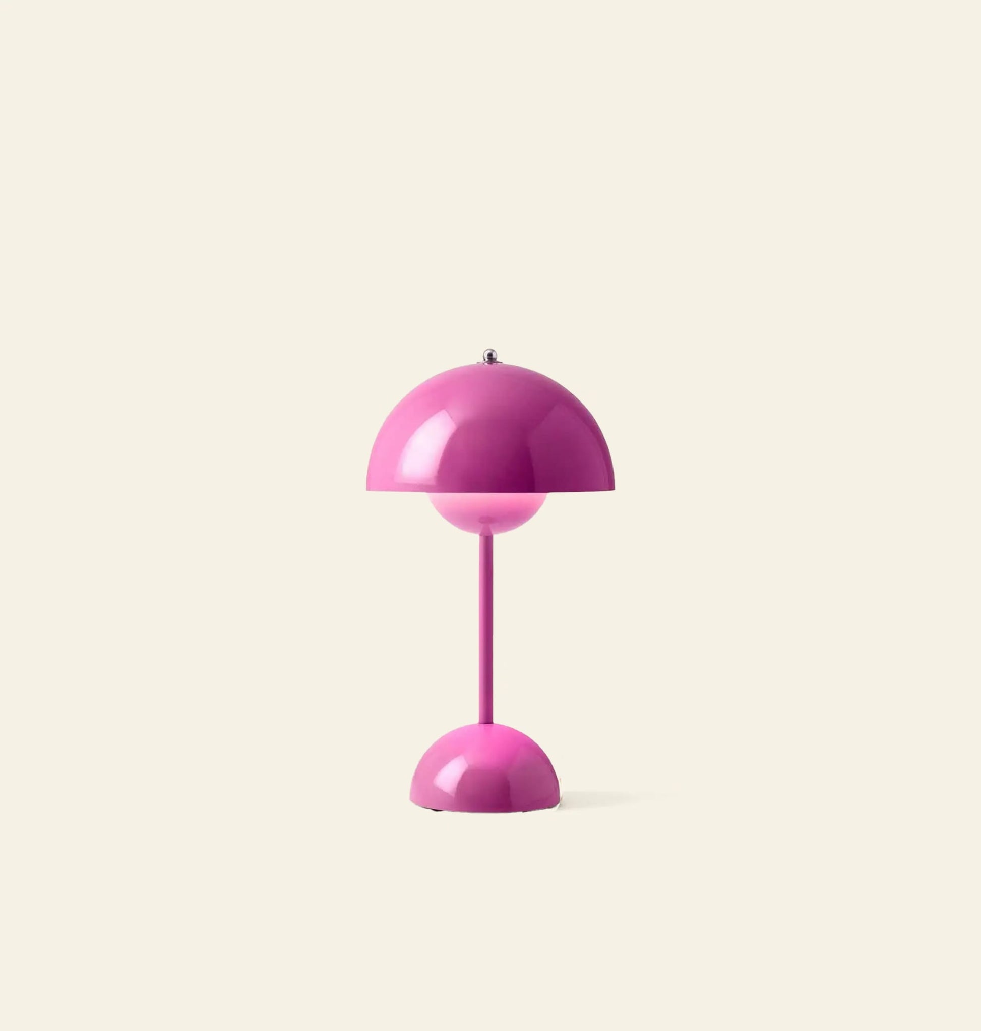 The &Tradition Flowerpot VP9 Portable Table Lamp by &Tradition features a modern pink dome shade and base, simple pink stem, and comes with a USB charging cable. Shown against a plain light beige background.