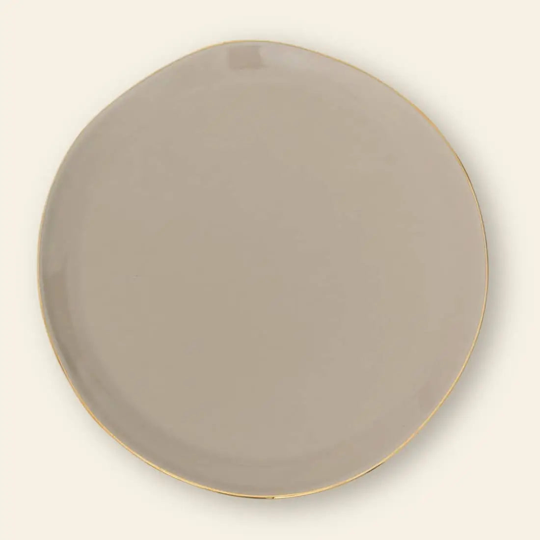 The Urban Nature Culture Good Morning Breakfast Plate is a round, off-white plate with a slightly irregular rim and a thin gold edge, showcased against a soft pastel background.