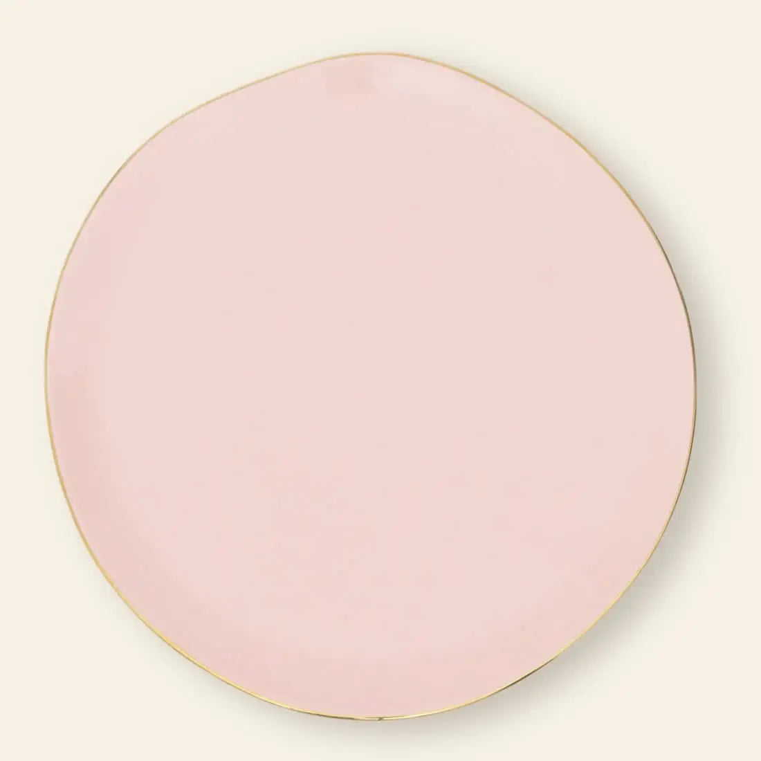 The Urban Nature Culture Good Morning Breakfast Plate is a round, pale pink plate with a thin gold rim and slightly irregular edge, shown against a softly pastel, light background.
