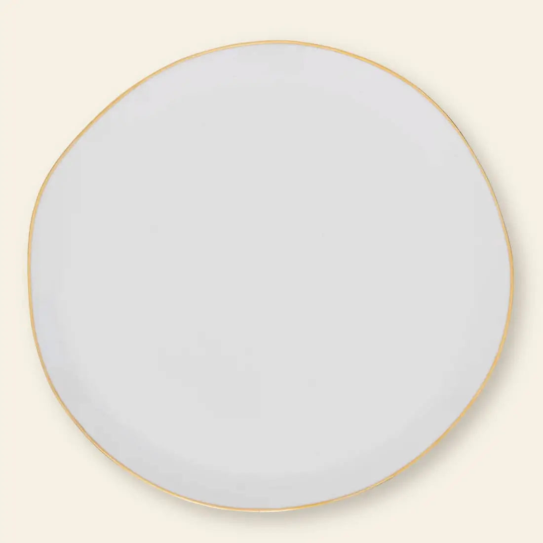 The Urban Nature Culture Good Morning Breakfast Plate is a round, white ceramic plate with a slightly irregular edge and thin gold rim, set against a light beige background with soft pastels.