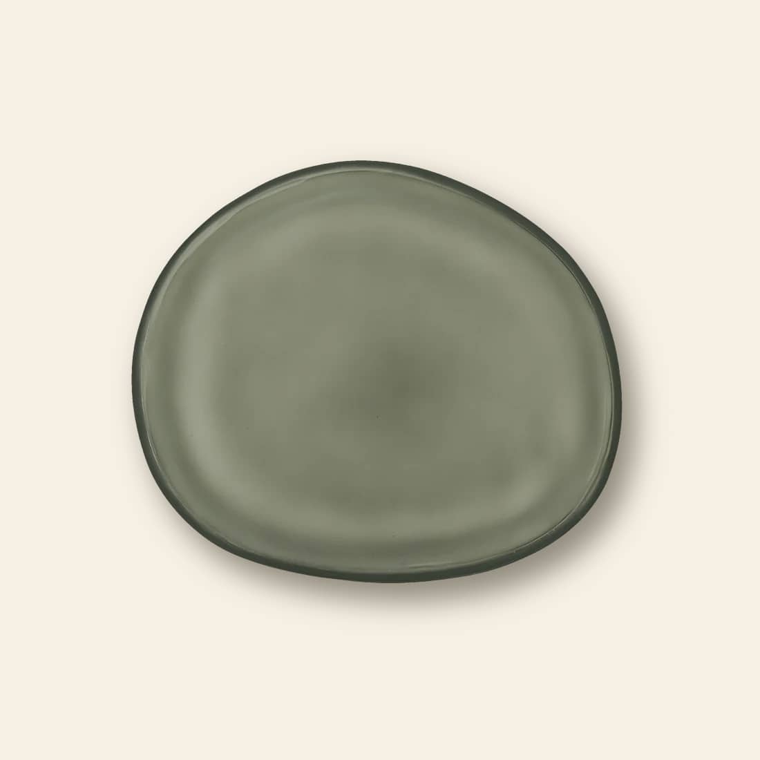 The Urban Nature Culture Plate Recycled Glass Frost, a round plate with uneven edges in earthy olive green tones, is displayed on a light beige background.