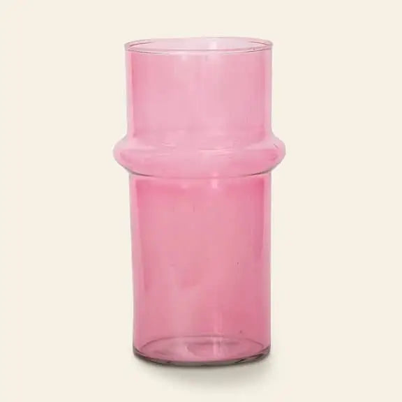 The Urban Nature Culture Vase Recycled Glass, Pink by Urban Nature Culture features a transparent pink design with a thick middle band, adding charm to your space. Displayed against a plain off-white background.