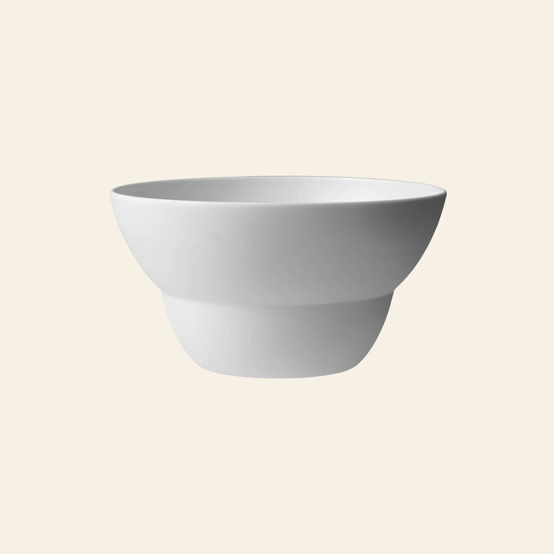 The Vipp Vipp218 Bowl, Large by Vipp is crafted from premium porcelain with a smooth, matte finish and is featured here against a light beige background.