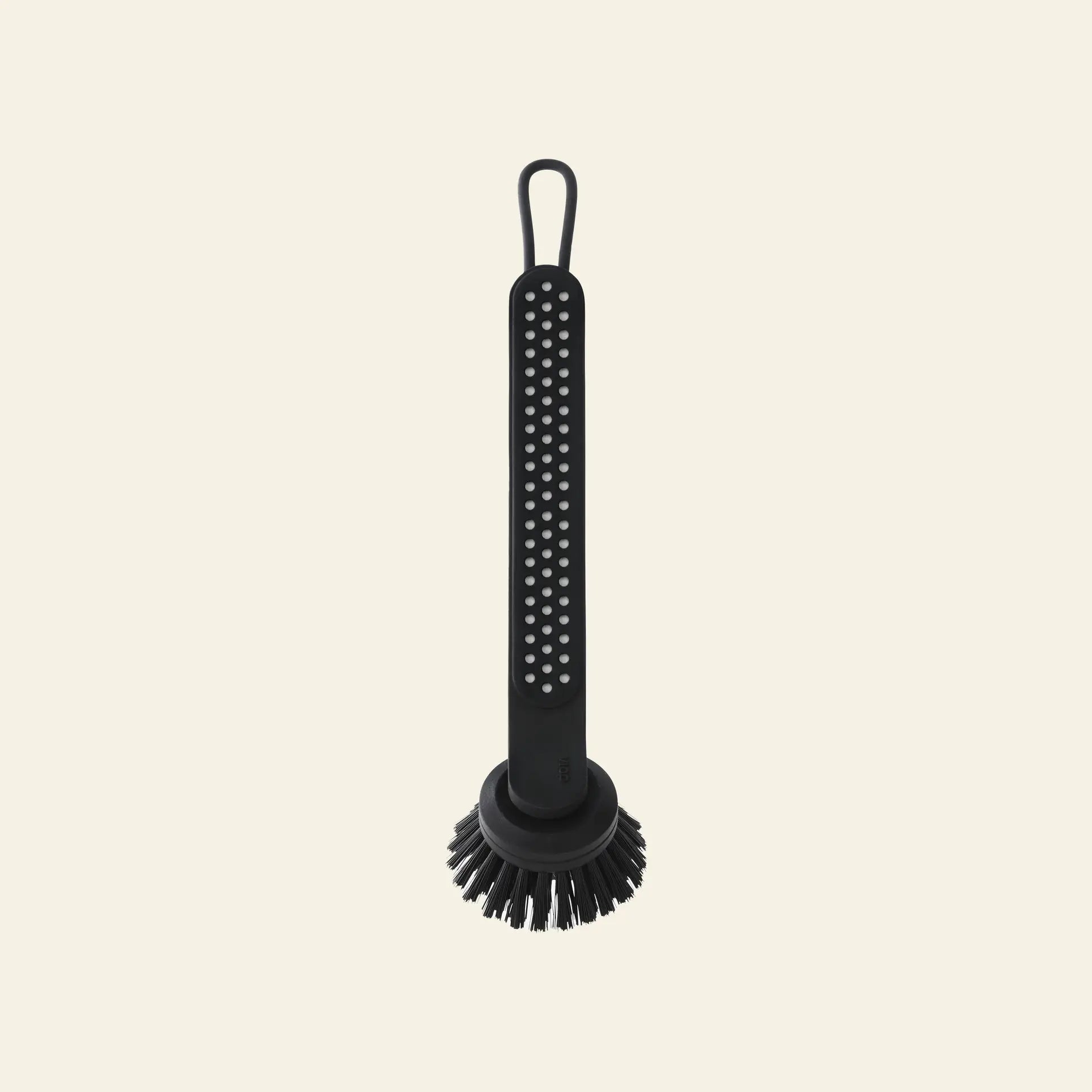 The Vipp Vipp280 Dishwashing Brush by Vipp features a long handle with dotted texture, a round replaceable brush head, and a hanging loop—ideal for efficient kitchen cleaning. Shown against a plain beige background.