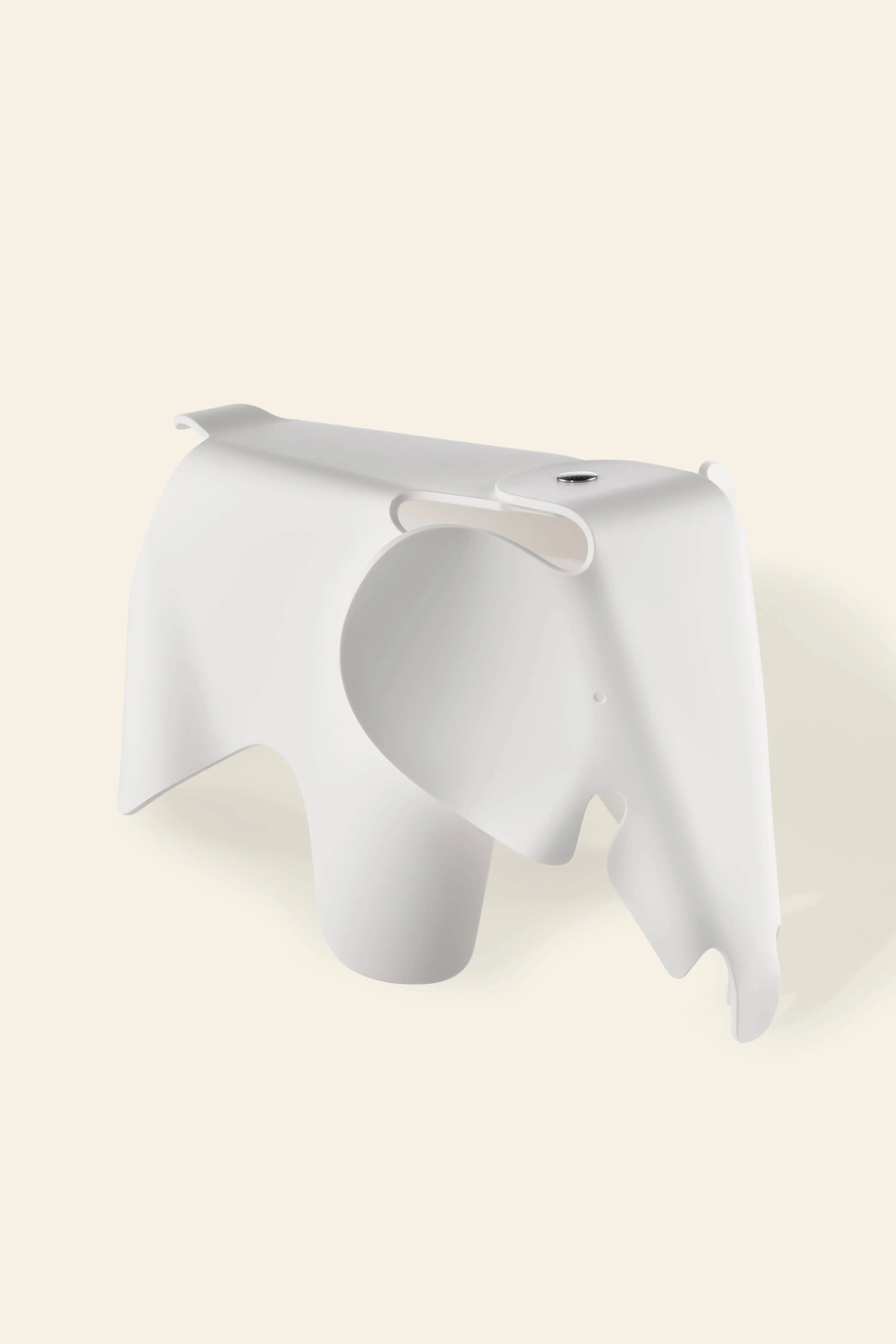 The Vitra Eames Elephant, Small by Vitra features smooth curves, a stylized trunk and ears, and a minimalist white designโmaking it an iconic decorative accent for any space.
