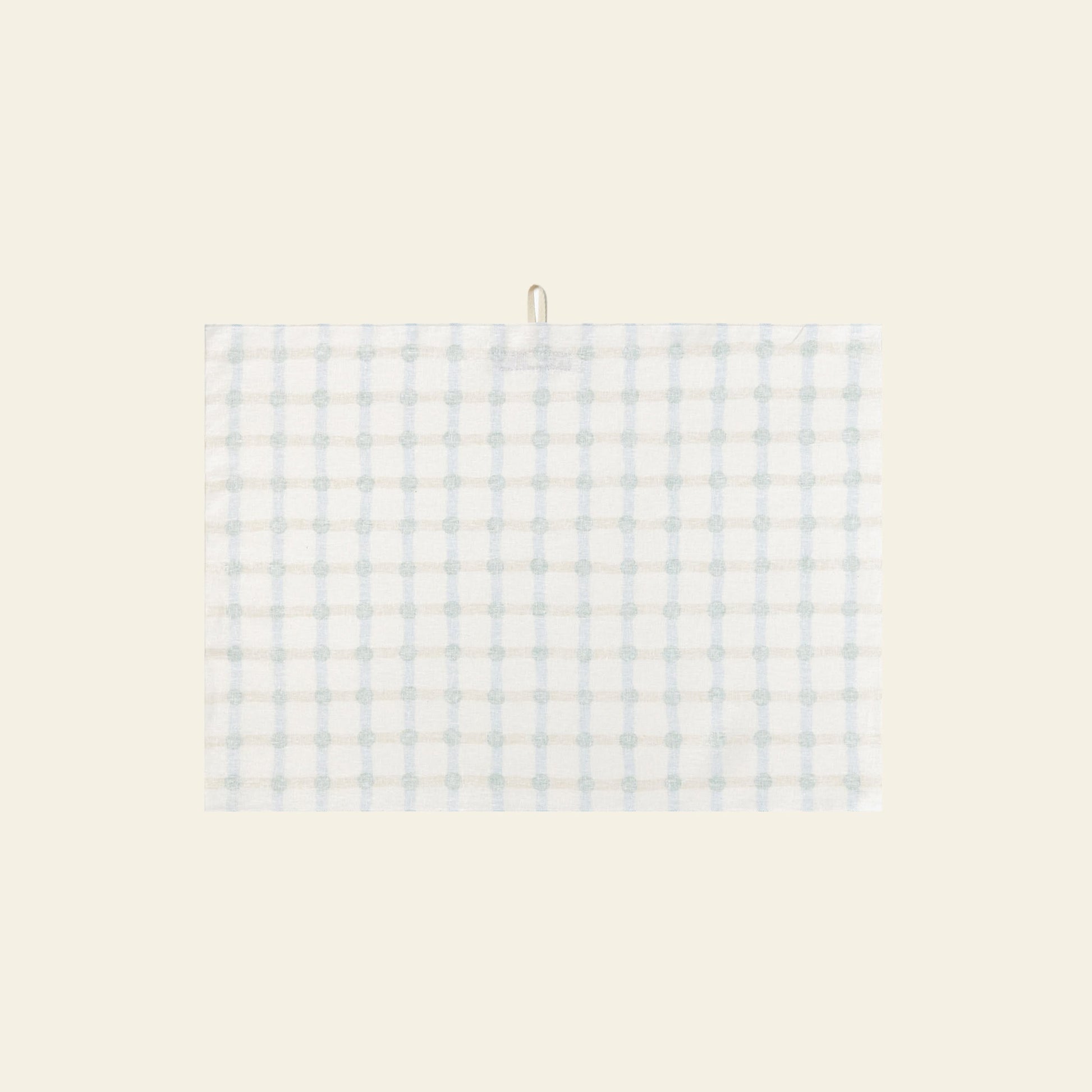 The WARMGREY TAIL Dot Check Kitchen Cloth 2 features a white base with light blue and grey plaid, hanging by a small top loop against a beige background—an elegant, versatile kitchen accessory from WARMGREY TAIL for any home.