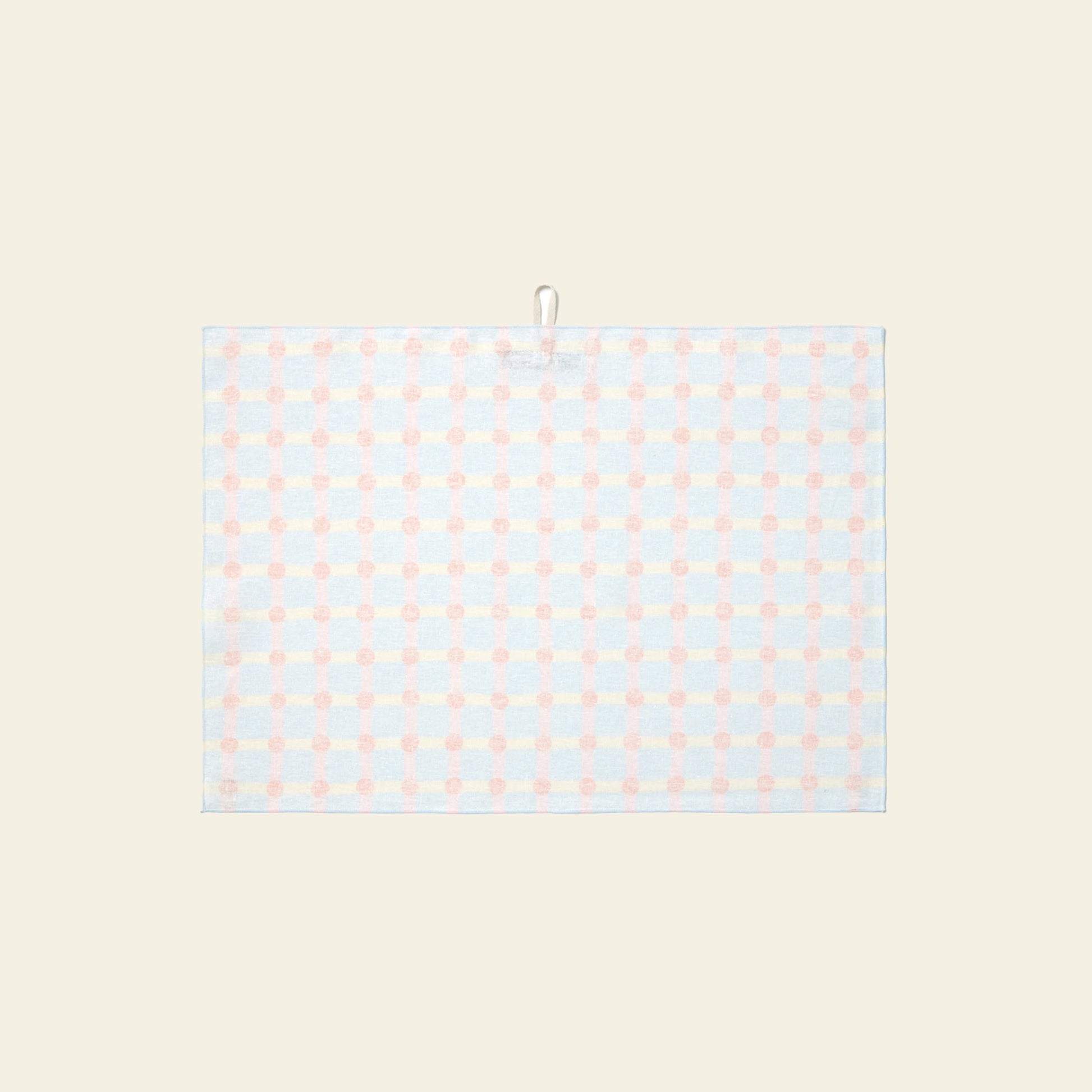 The WARMGREY TAIL Dot Check Kitchen Cloth 2 features a light blue and pale pink checkered design on beige, with a handy hanging loop for added practicality and style.