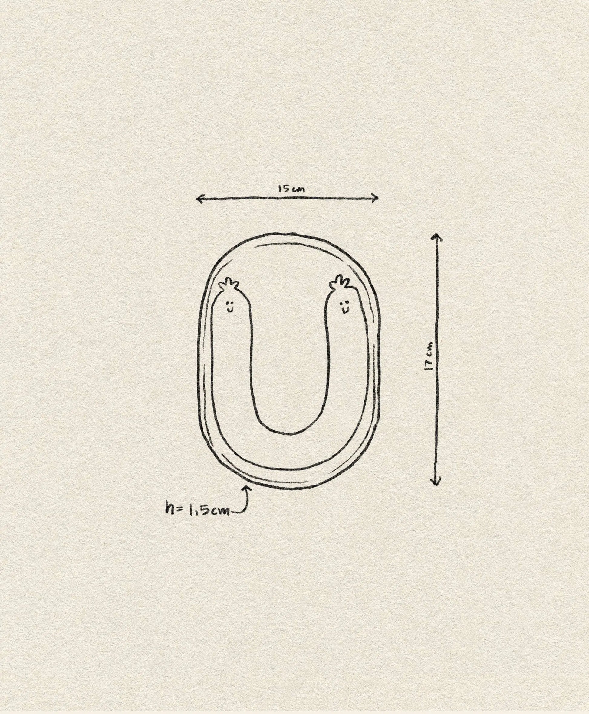 The Wobbly Studio Happy Things Plate - Saucisse features a hand-drawn U-shaped sausage with cheerful faces, simple arrows, and text on a beige textured background. Plate measures 15 cm wide, 17 cm tall, and 1.5 cm high.