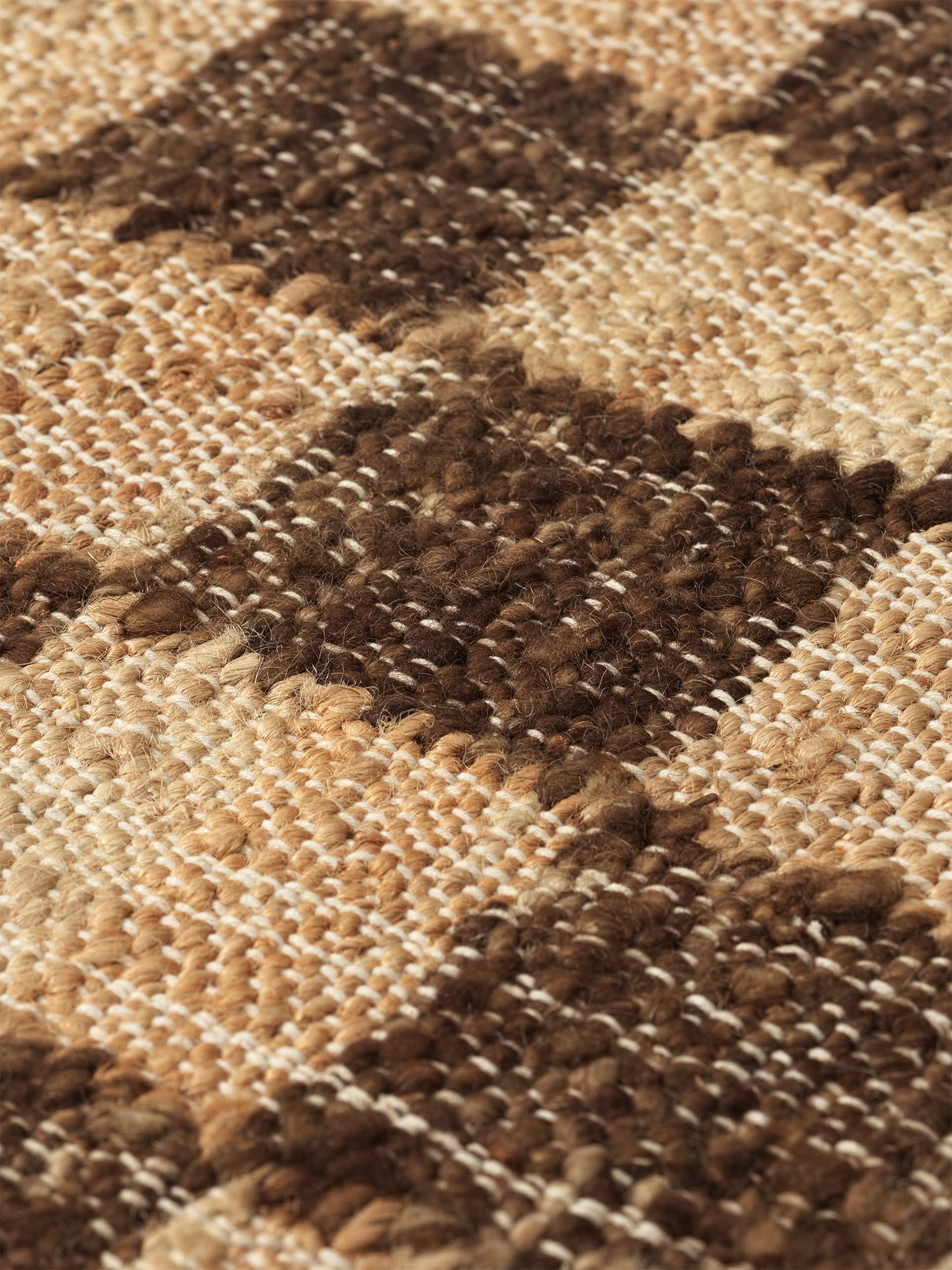 Close-up of the ferm LIVING Check Wool Jute Rug (200x300), highlighting its timeless brown and beige check pattern and detailed woven texture from quality yarns.