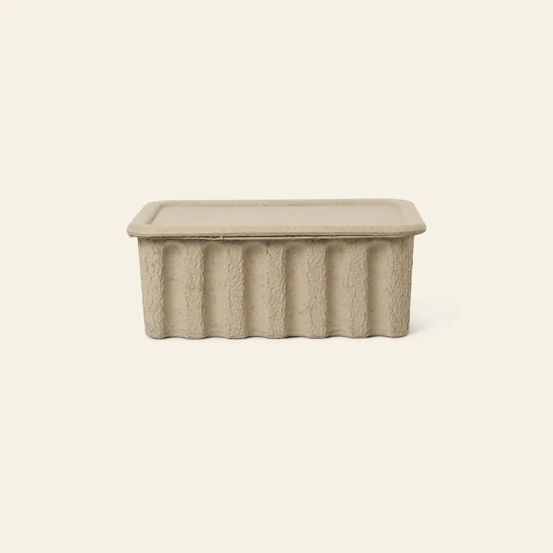 The ferm LIVING Paper Pulp Box Large, Set of 2, are rectangular beige storage containers crafted from recycled paper pulp with fitted lids, shown against an off-white background.