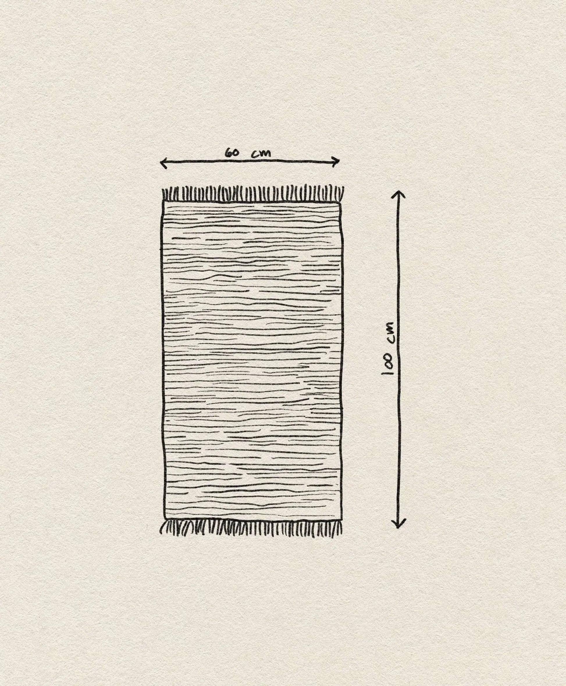 The ferm LIVING Melange Rug by ferm LIVING is a hand-drawn, easy-care rectangular rug with fringes on the short ends. It measures 60 x 100 cm, shown with labeled arrows on a textured off-white paper background.