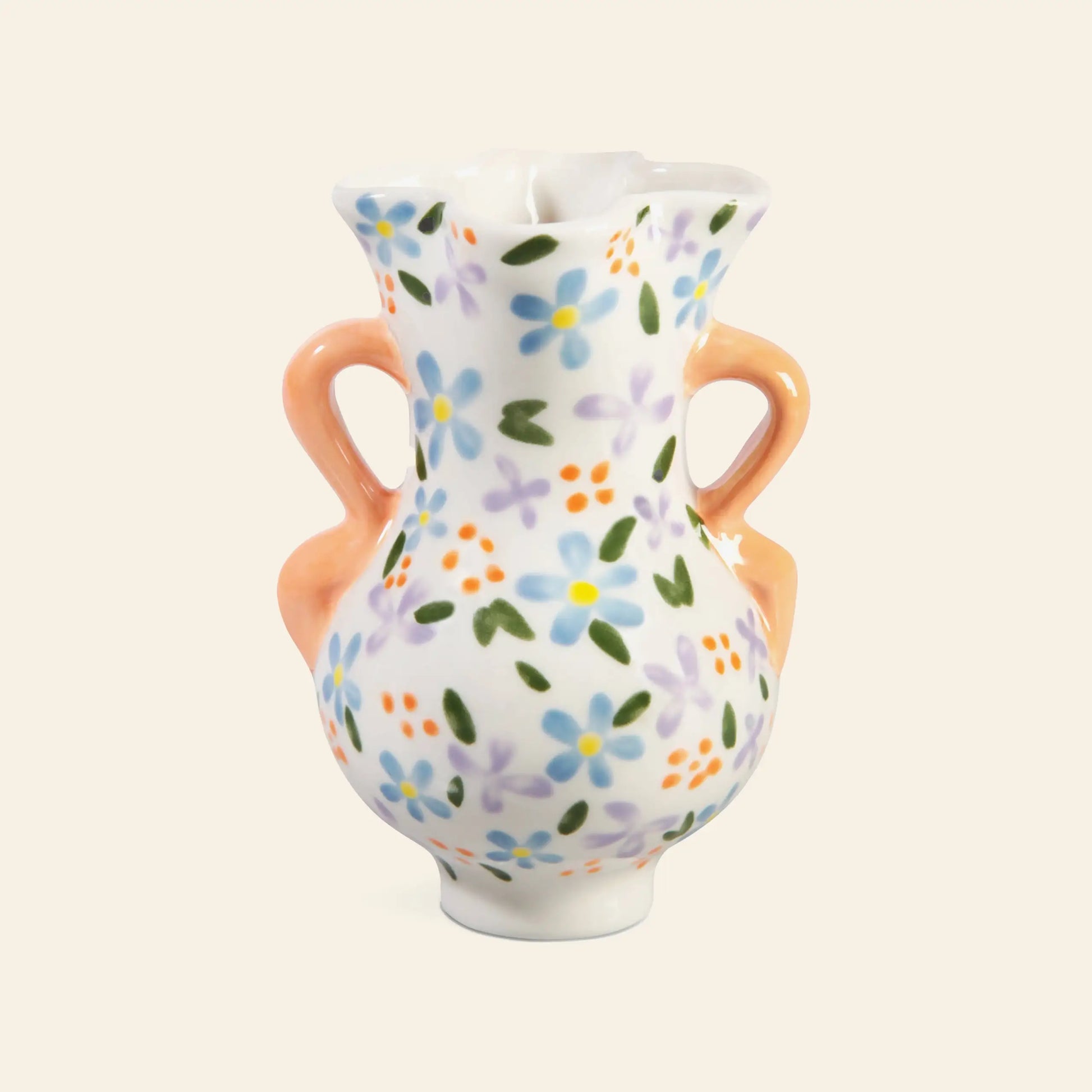 The &klevering Bloom Vase by &klevering is a small ceramic vase with two orange handles, adorned with hand-painted petite blue, purple, orange, and green flowers on a white background for a romantic touch.