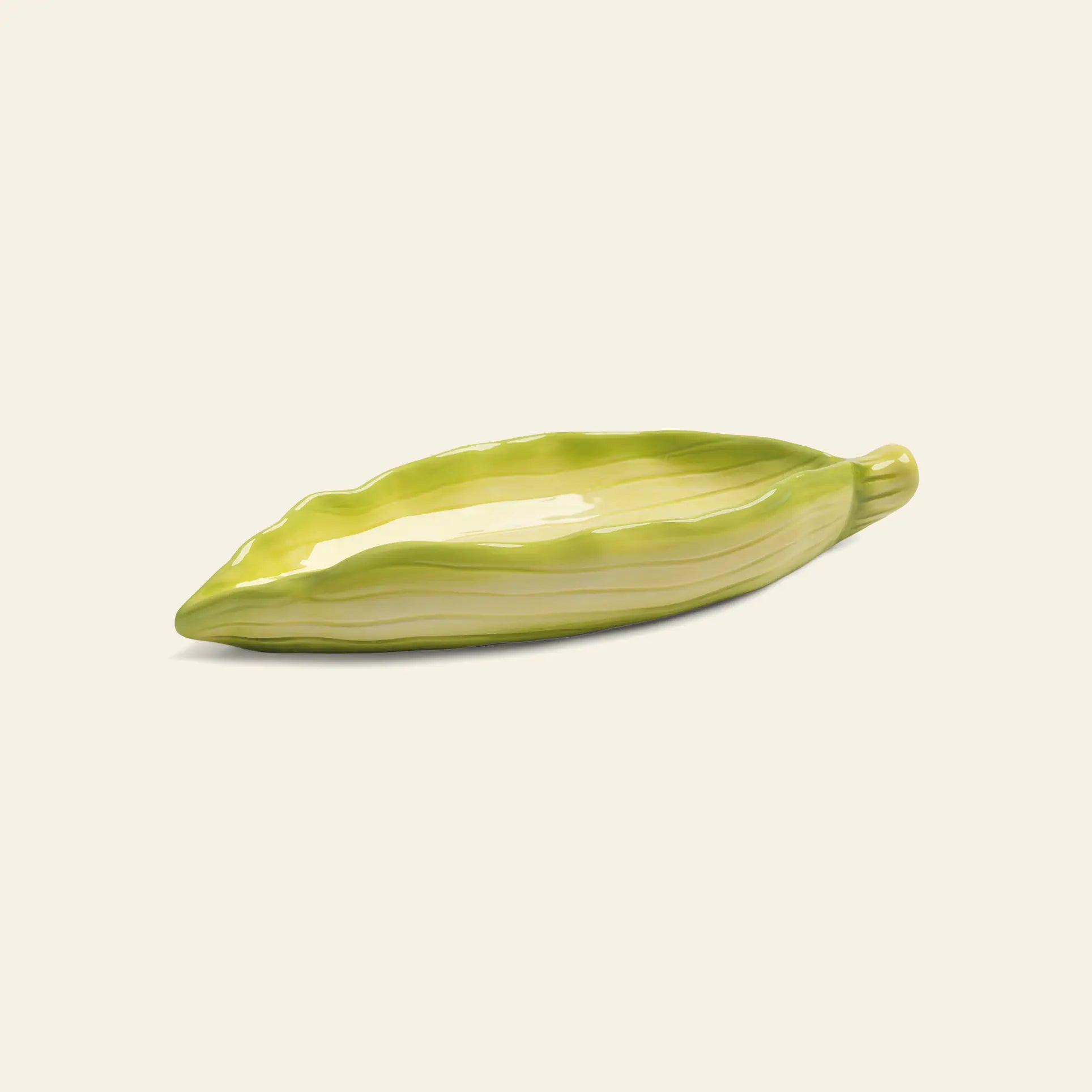 The &klevering Corn Salt & Pepper Set by &klevering features ceramic pieces shaped and painted like green corn cobs with a glossy finish—an eye-catching addition to your dining table or kitchen, set against a simple light background.