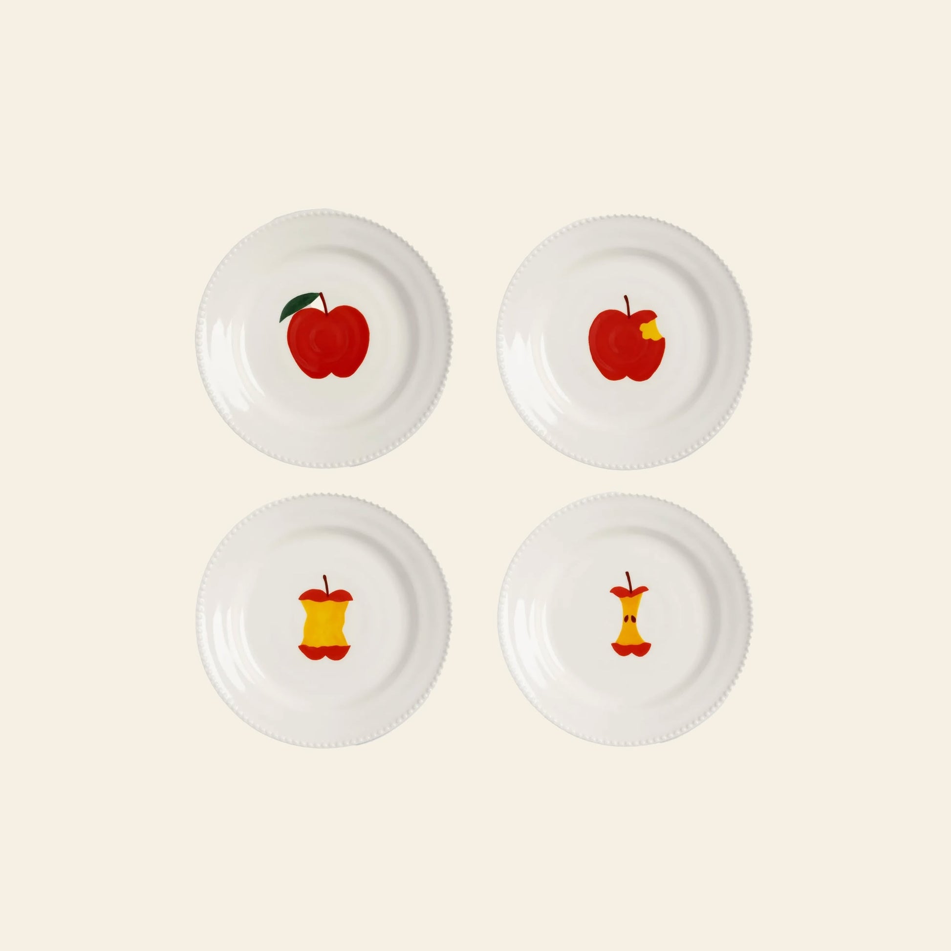 Four white &klevering Haines Plate Small, Set of 4, arranged in a square, each shows a different stage of a red apple being eaten—bringing whimsical charm to your table against a simple light background.