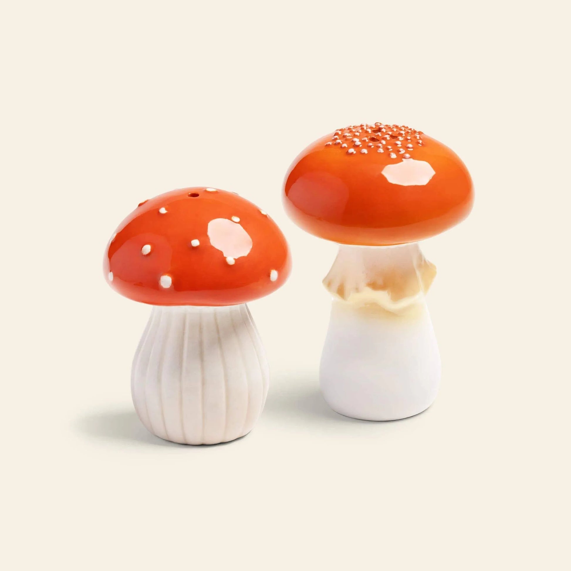 The &klevering Mushroom Salt & Pepper Set by &klevering features ceramic shakers shaped like red and white mushroomsโideal for adding a whimsical touch to your kitchen decor.