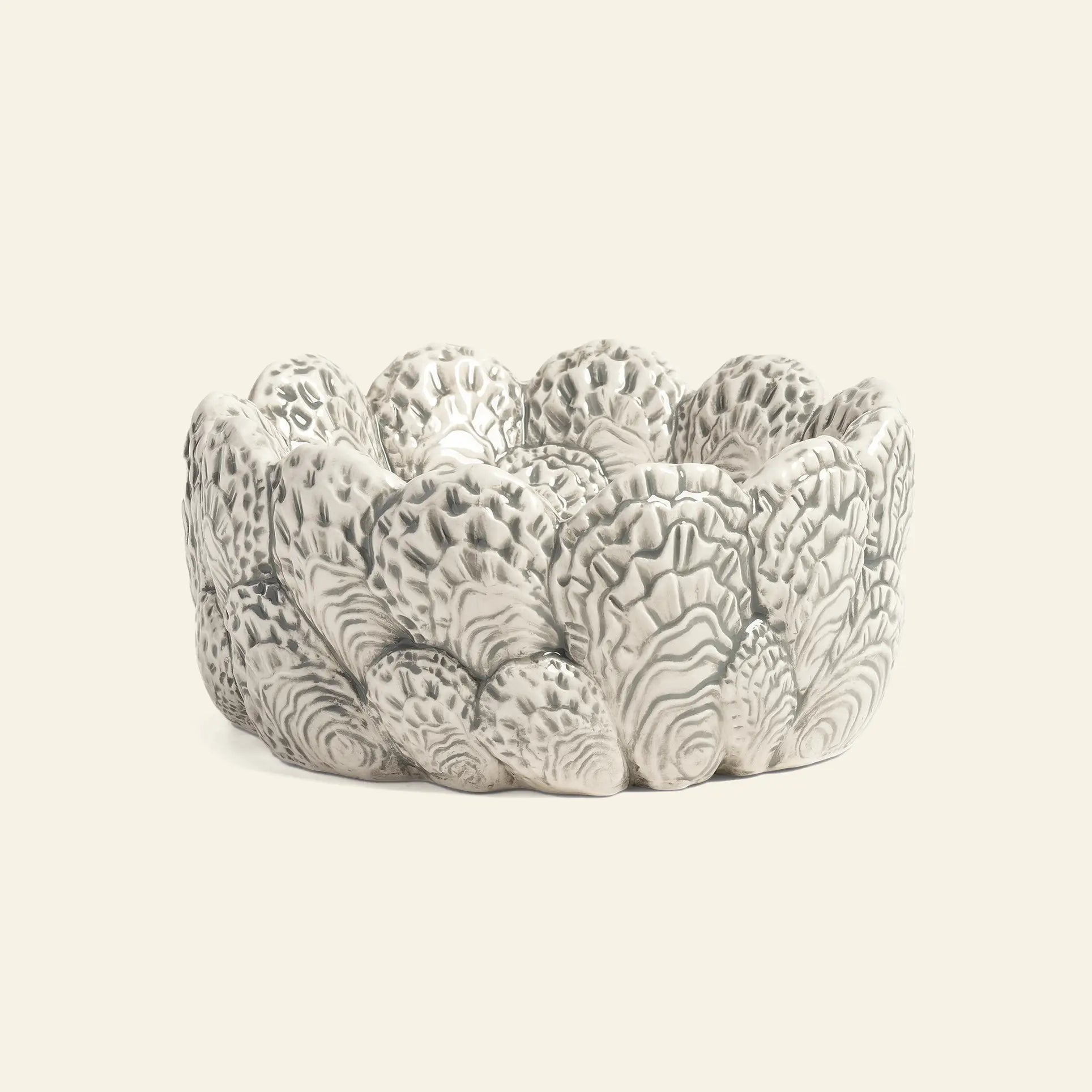 The &klevering Oyster Bowl by &klevering features a textured, scalloped design in white and gray, resembling oyster shellsโideal for oyster lovers or serving appetizers. Shown on a plain light background.