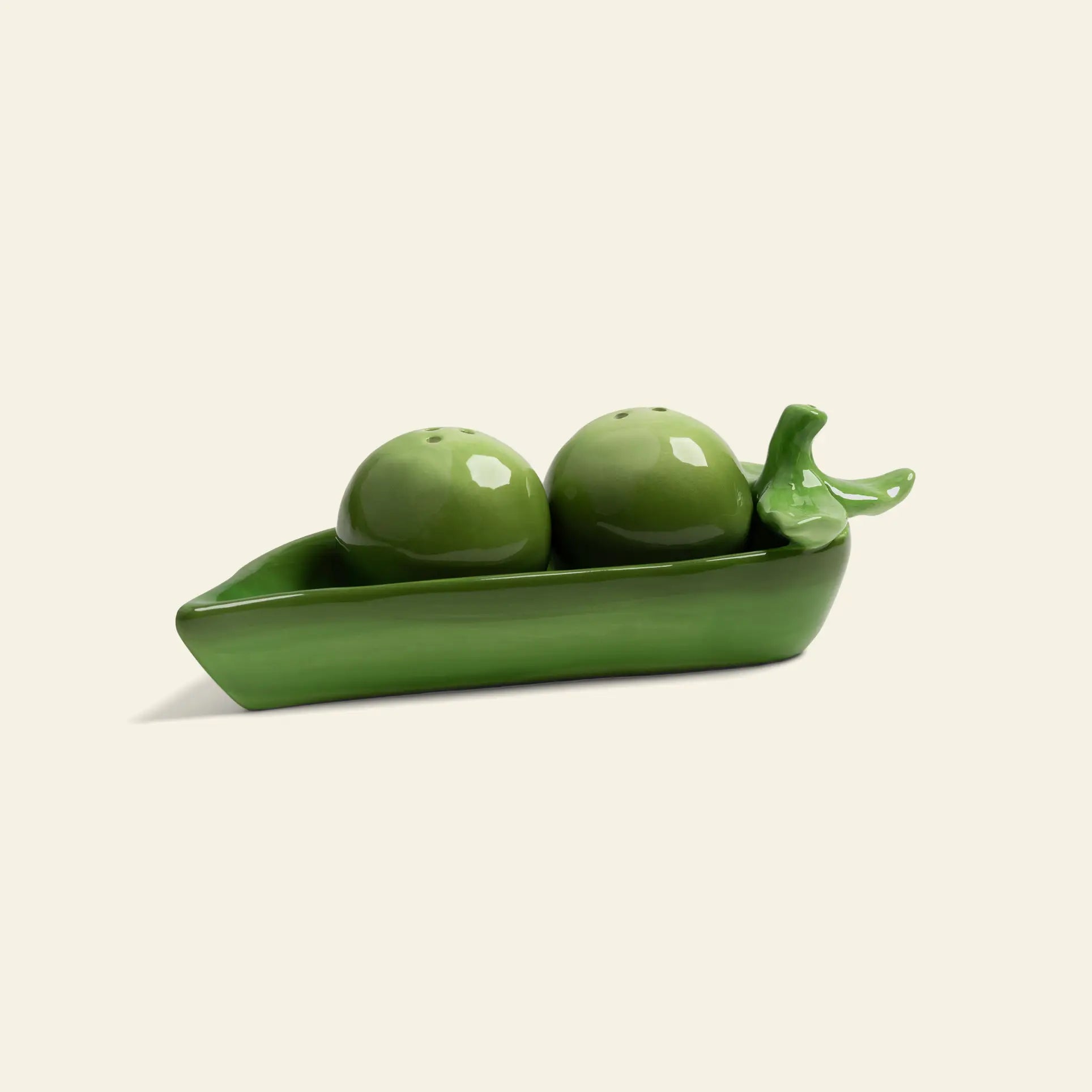 Enhance your kitchen or dining space with the &klevering Pea Salt & Pepper Set—charming ceramic shakers shaped like green peas in a pod, featuring a glossy finish and designed by &klevering.