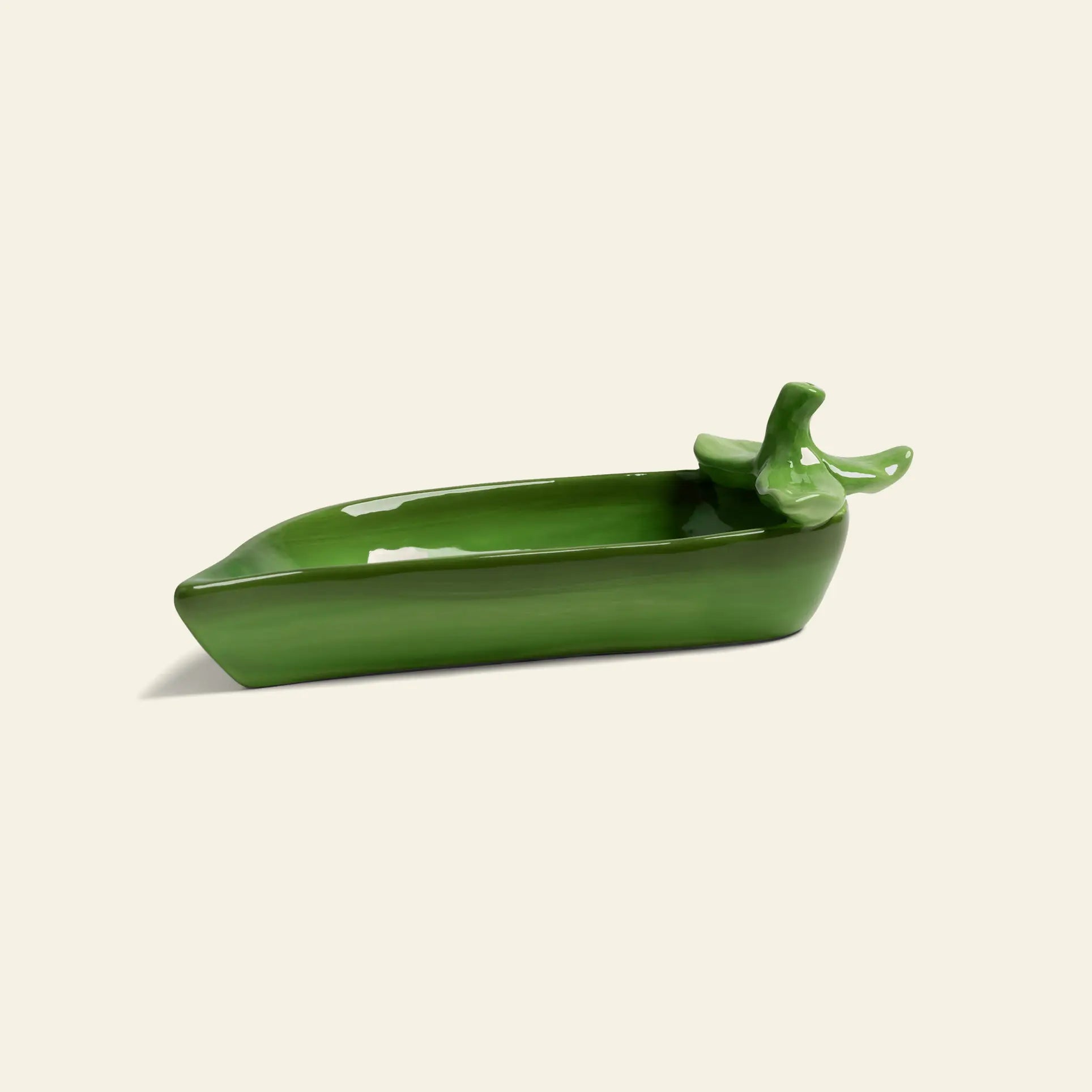 The &klevering Pea Salt & Pepper Set by &klevering features a playful green pea pod design, ideal for adding charm to your dining table or kitchen counter. Displayed against a simple light background.