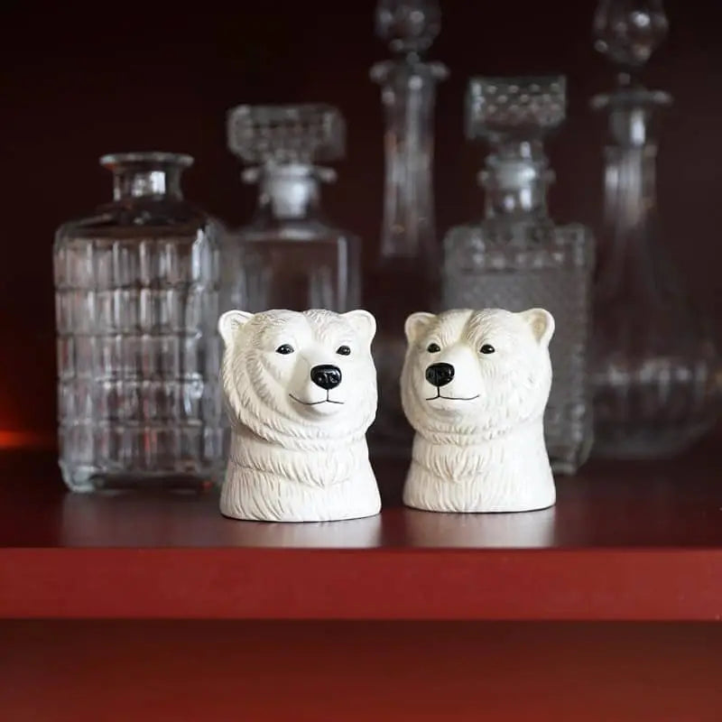 The &klevering Polar Bear Salt & Pepper Set by &klevering adds charm to your table, complementing elegant clear glass decanters with decorative stoppers.