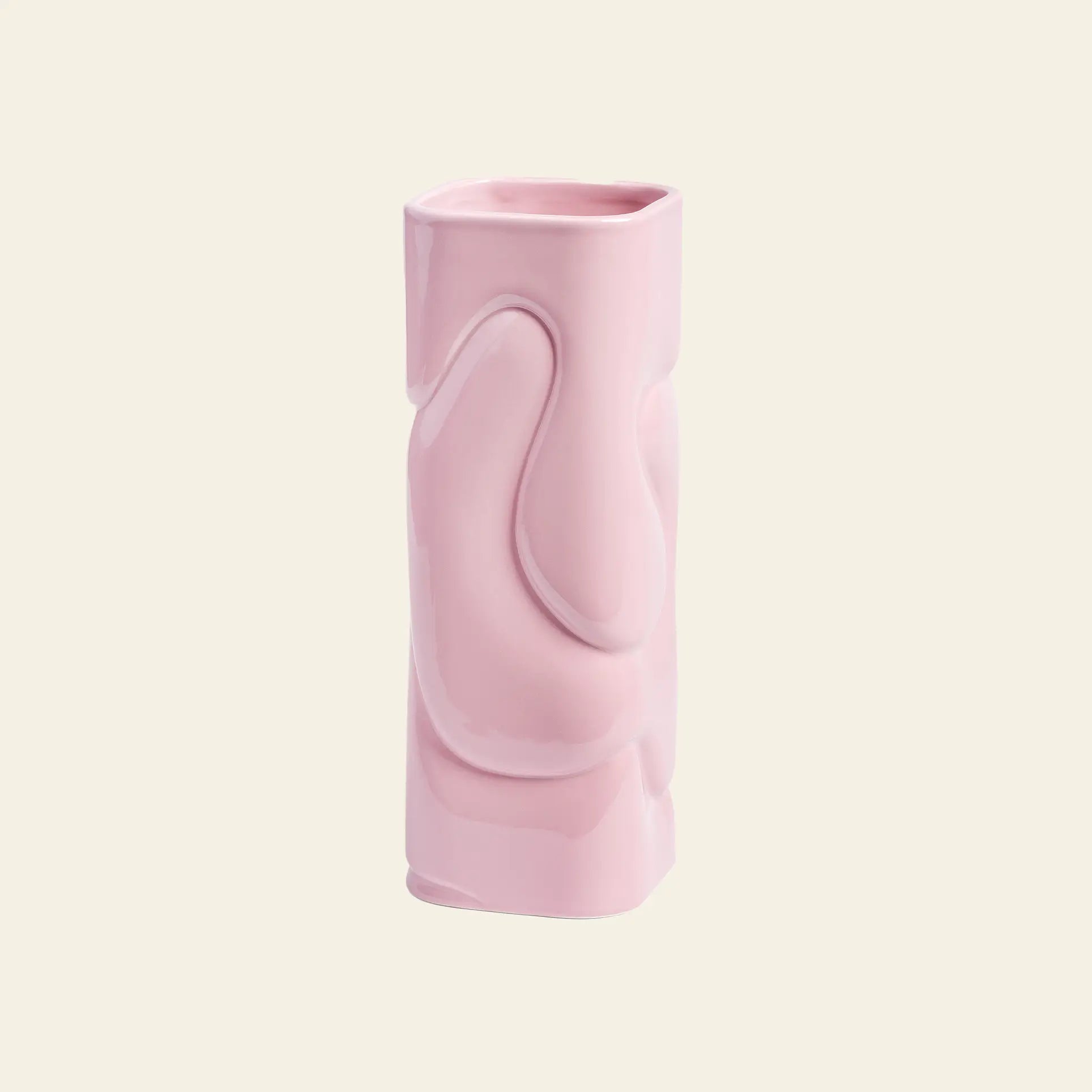 The &klevering Puffy Vase by &klevering features a glossy light pink ceramic finish and a unique hand-sculpted design, making it ideal for vibrant flower displays. Displayed against a plain off-white background.