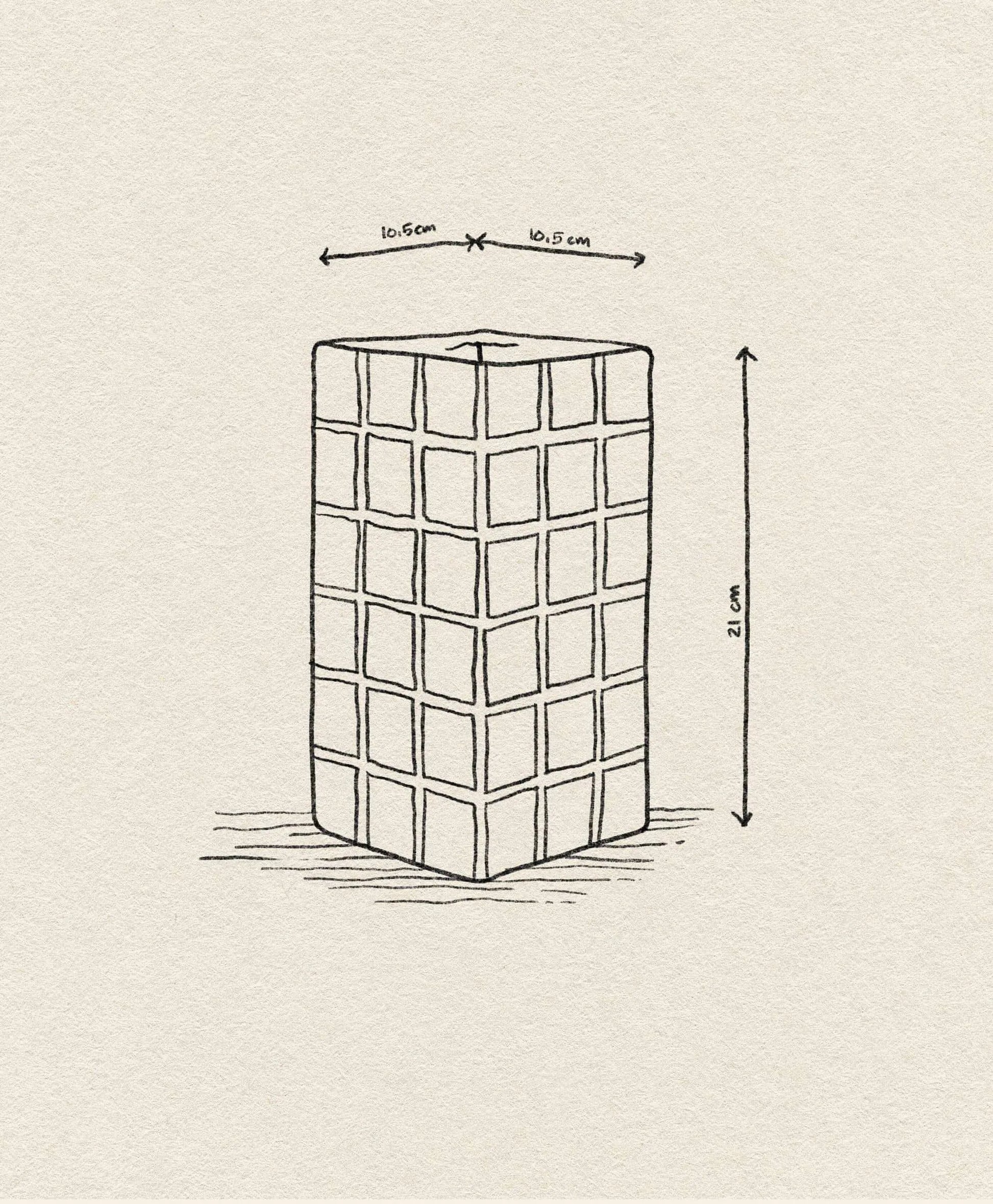 Line drawing of the &klevering Tiled Vase Pink by &klevering, featuring a rectangular block with a candy-coloured tile pattern; measures 21 cm tall and 10.5 cm wide/deep, shown on textured paper with arrows indicating dimensions.