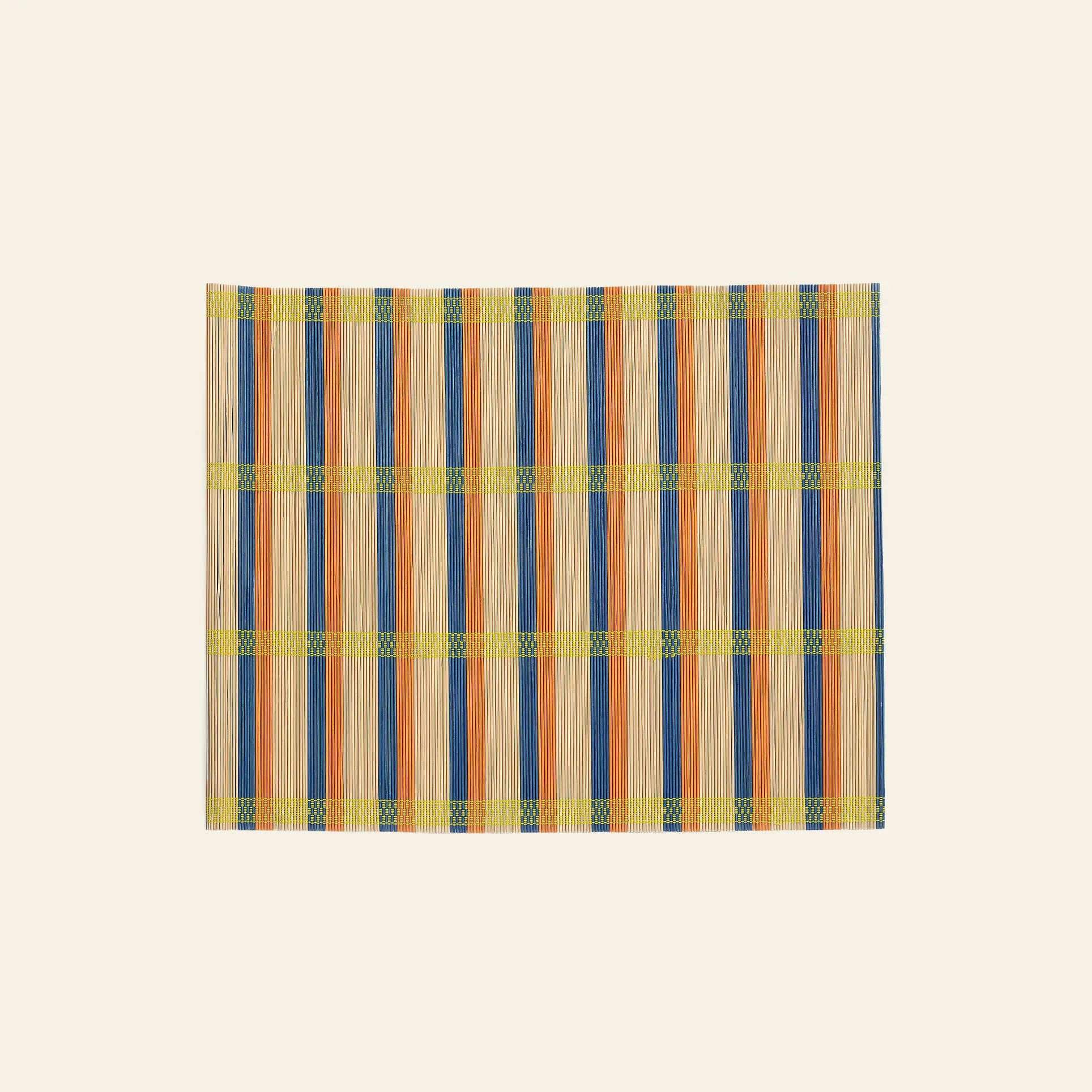 The &klevering Umami Placemat, Set of 4, features a rectangular bamboo design with blue, orange, and yellow vertical stripes on beige—ideal for adding style to your dining table.