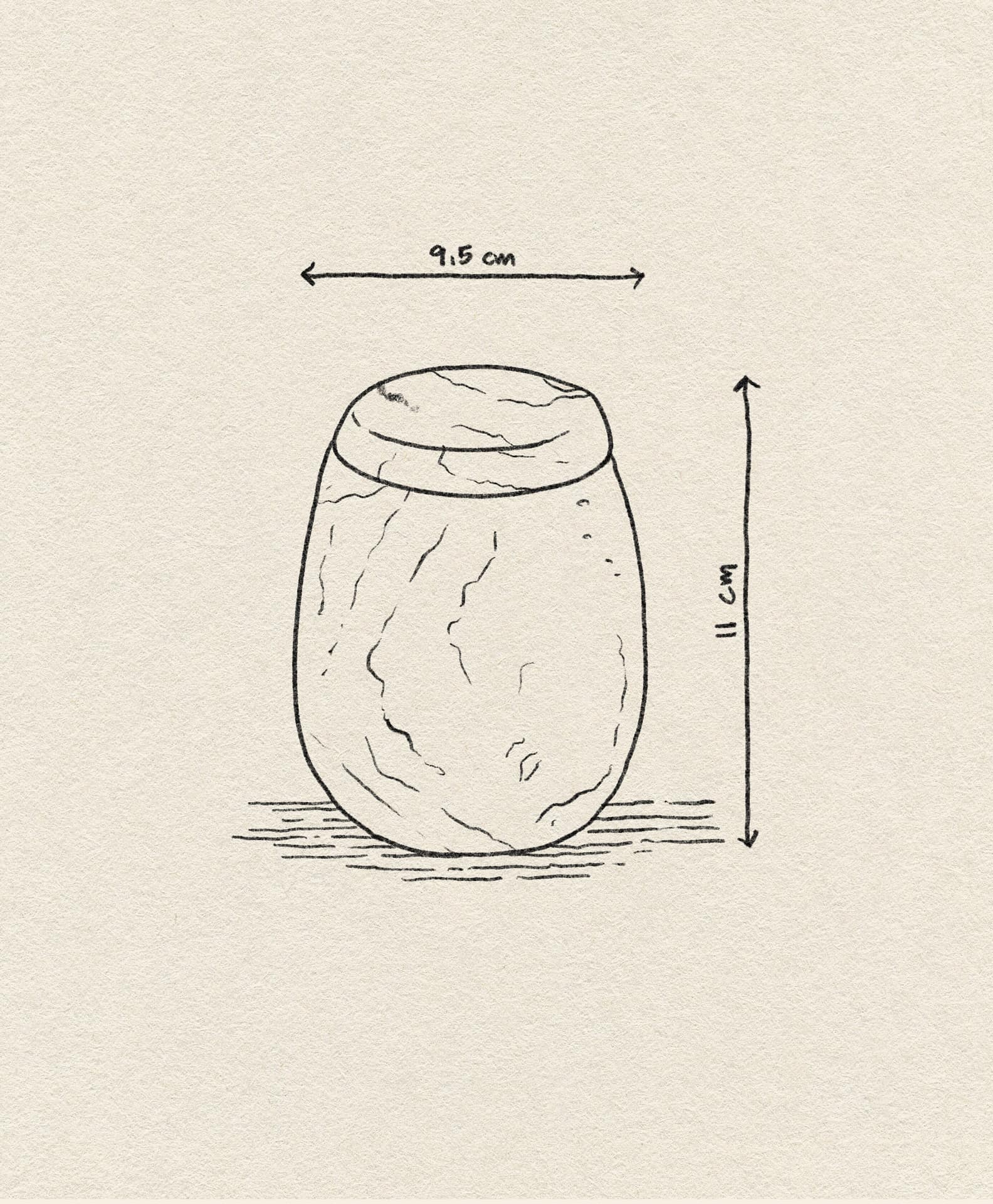 A hand-drawn illustration of the stillgoods Ecru Jar, an oval jar with a lid. Ideal for condiments or as an organizer, it measures 9.5cm wide by 11cm tall—dimensions shown with arrows and labels on beige textured paper.