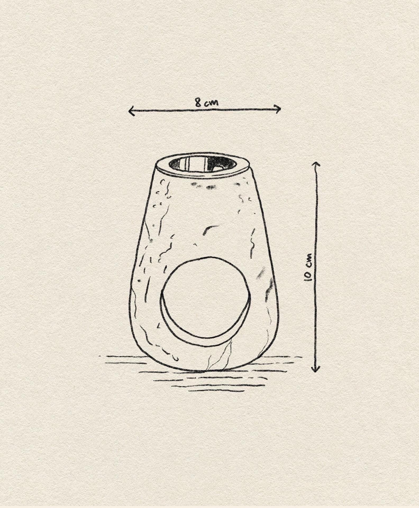 A hand-drawn sketch of the stillgoods Eli Oil Burner, a cylindrical essential oil diffuser by stillgoods with a large circular side opening, rough texture details, and labeled measurements showing its 8 cm width and 10 cm height.