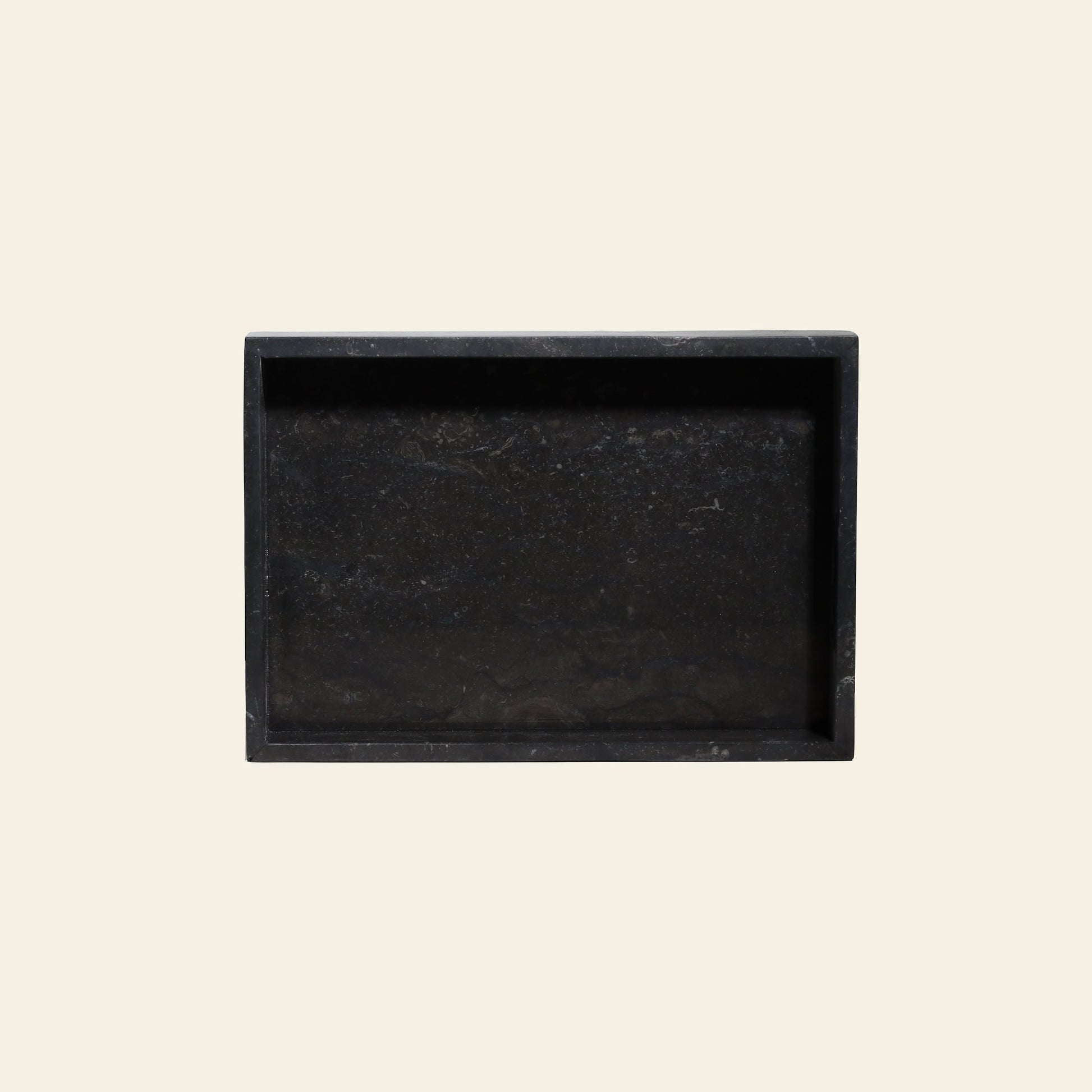 The stillgoods Mini Valor Tray offers a sleek rectangular black marble design with raised edges and a low profile, making it ideal for organizing your essentials stylishly in any setting.