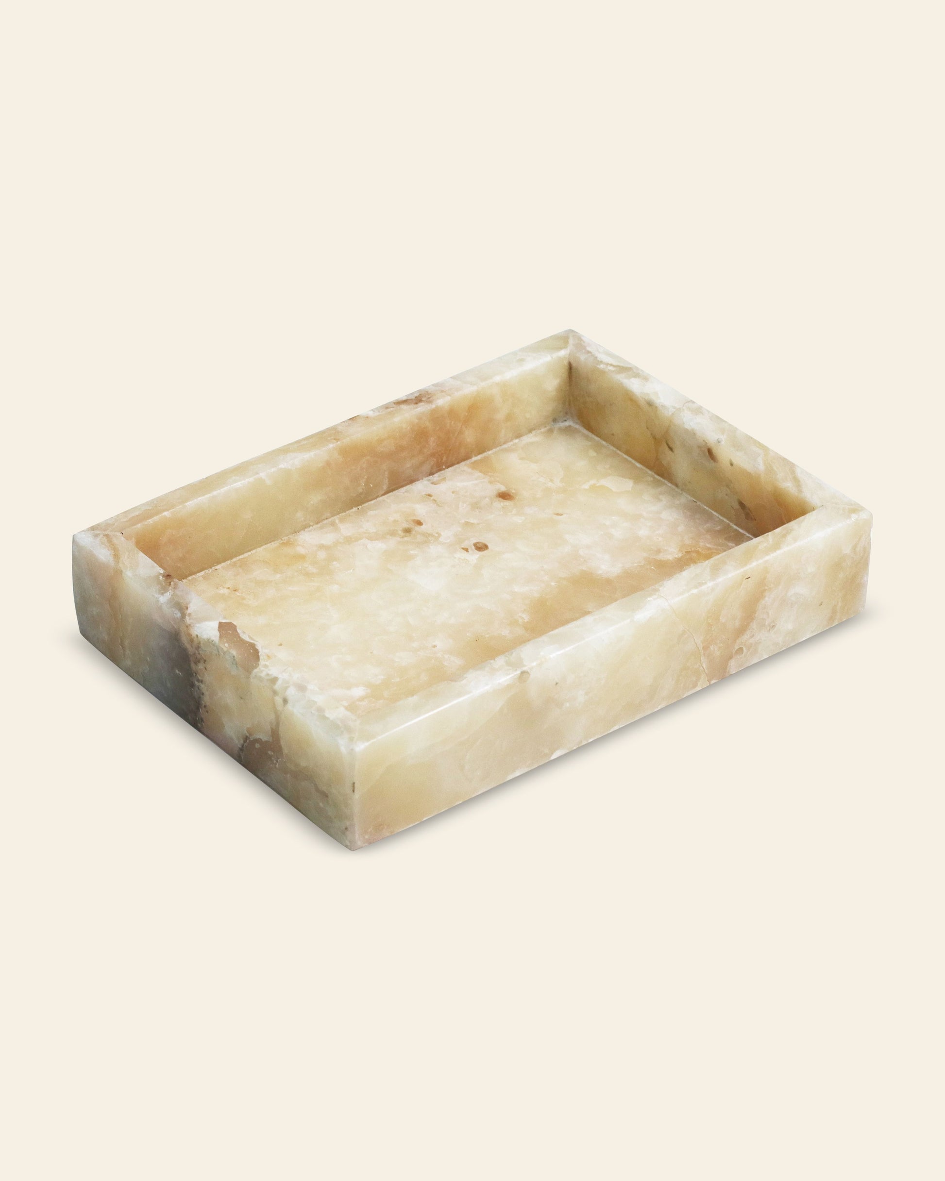 The stillgoods Mini Valor Tray features a low-profile design, crafted from polished light brown and beige marble with natural veining—ideal for stylishly displaying your organized essentials on any surface.
