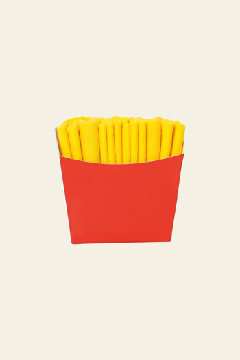 Eat My Socks French Fries Socks by Eat My Socks come in a red paper container, with yellow socks rolled to look like real fries—unique accessories that stand out against a plain, light background.