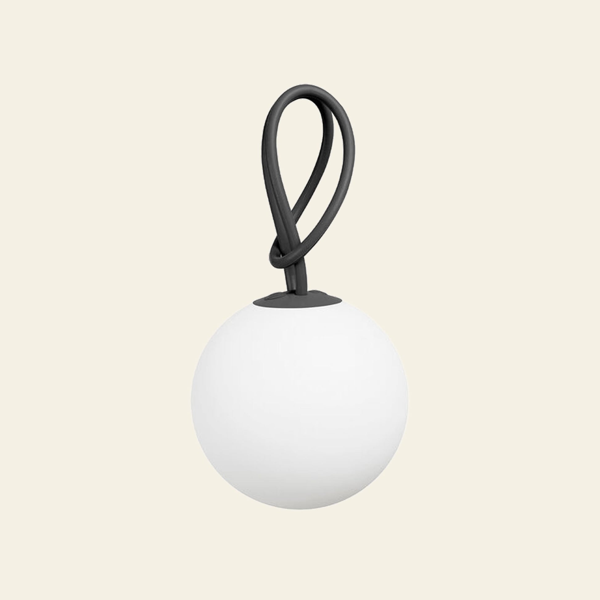The Fatboy Bolleke by Fatboy is a round, white, matte globe-shaped portable light with a black flexible loop handle, set against a light beige background—ideal as an indoor-outdoor lighting solution or stylish hanging lamp.