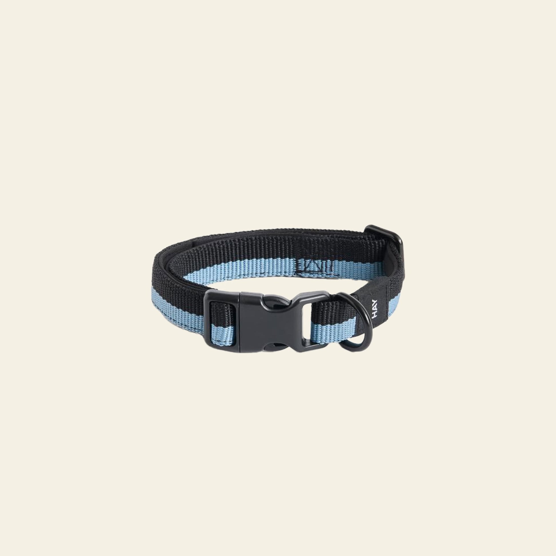 The HAY Dogs Collar Flat S/M by HAY is a blue and black adjustable nylon collar with a recycled polyester strap, adjustable buckle, plastic clasp, and metal ring for a leash or tag, shown on a light background.