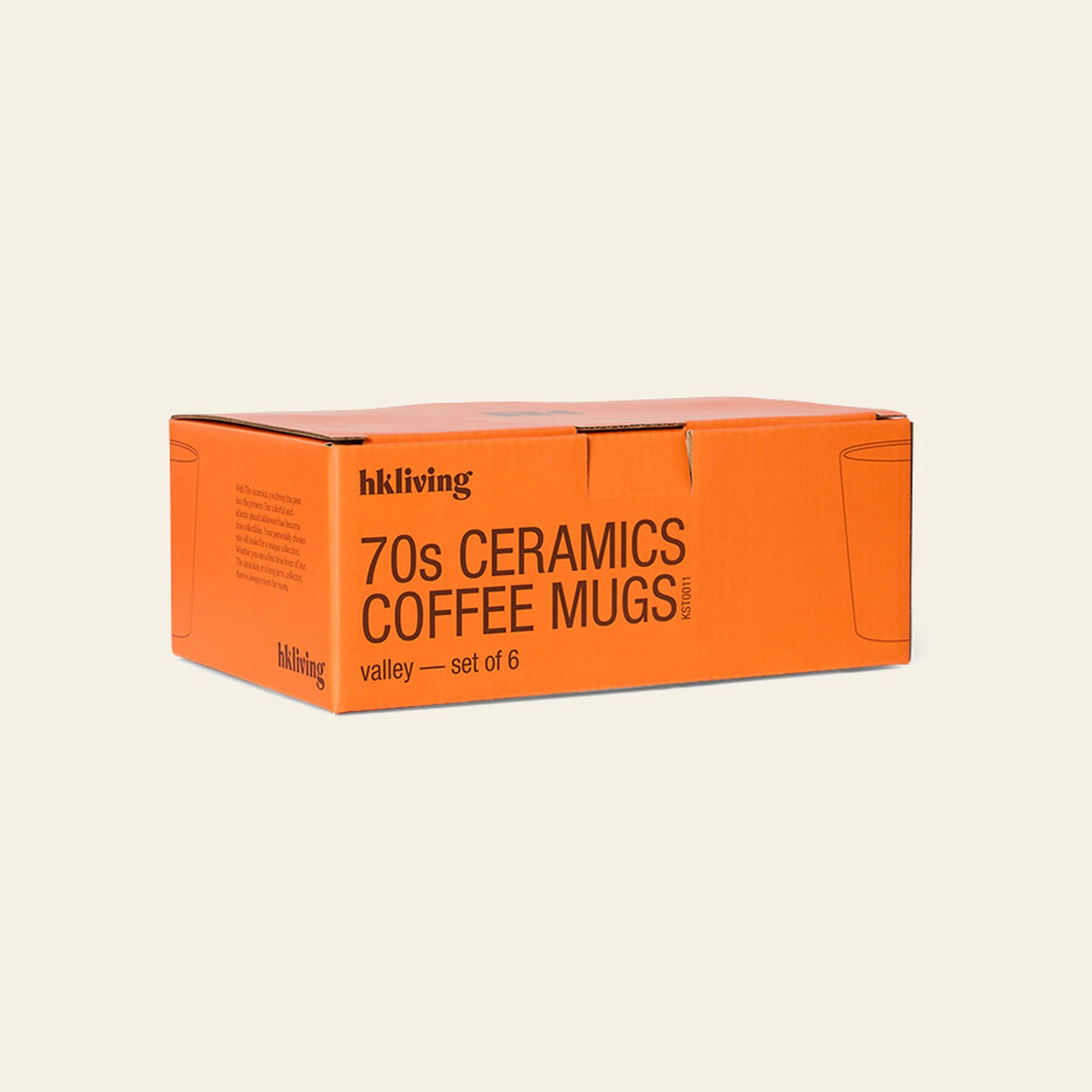 An orange rectangular box labeled HKliving 70s Ceramics: Coffee Mugs, Set of 6 is displayed against a plain background, with minimal line mug drawings decorating its sides.