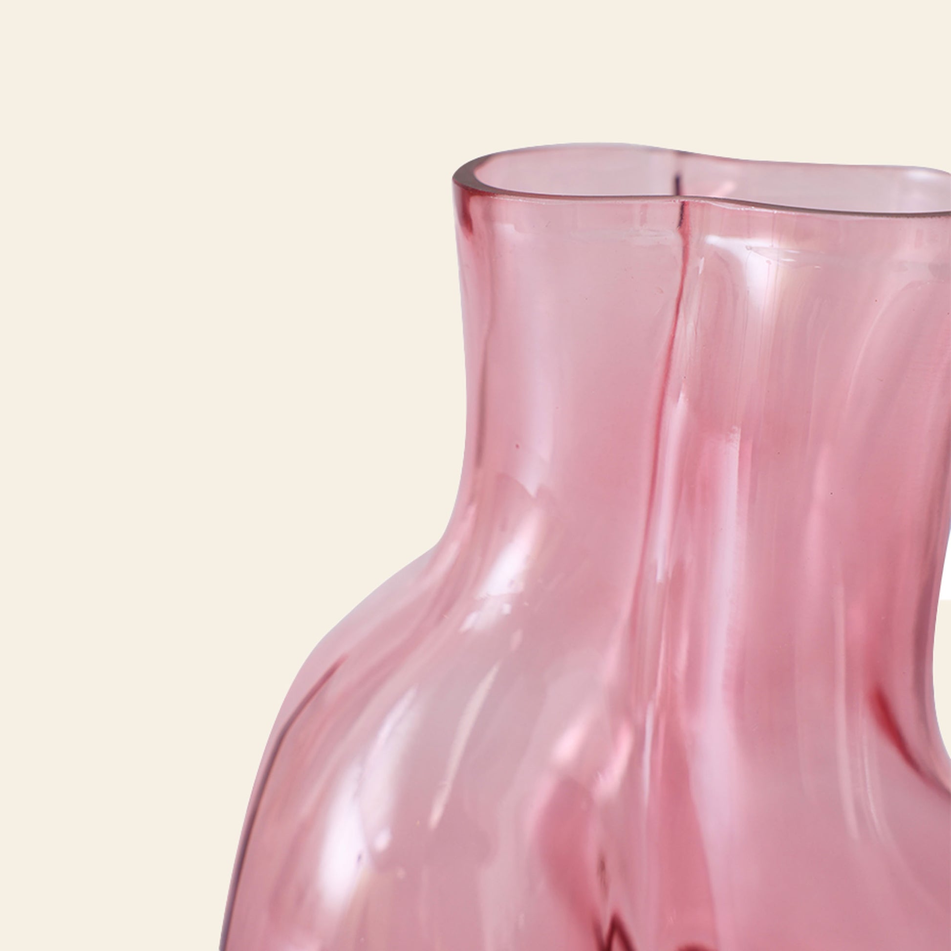 A close-up of the HKLIVING Gleam Glass Vase—a pink, translucent vase with a wavy, asymmetrical design by HKLIVING—displayed against an off-white background; an elegant accent for modern interiors.