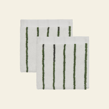 Two OYOY Living Design Raita Wash Cloths, made from organic cotton terry with vertical green stripes, are stacked against a light beige background. Pack of 2.