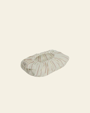 The OYOY Living Design Wet Wipes Cover in Nutmeg features subtle red stripes and gathered elastic edges, shown against a plain cream background.