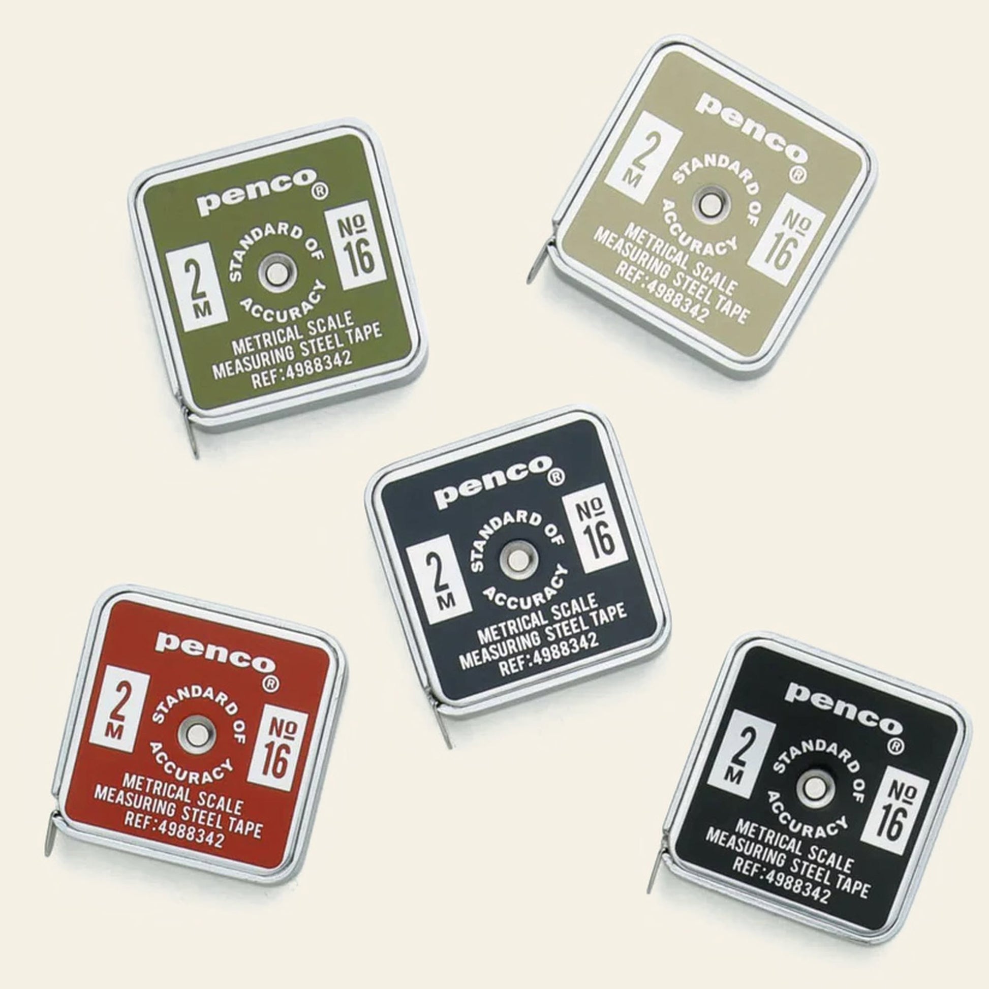 Five Penco Pocket Measure tapes in green, khaki, red, black, and navy blue feature a retro rounded-square case and 2-meter stainless steel tape, each marked with the Penco brand.