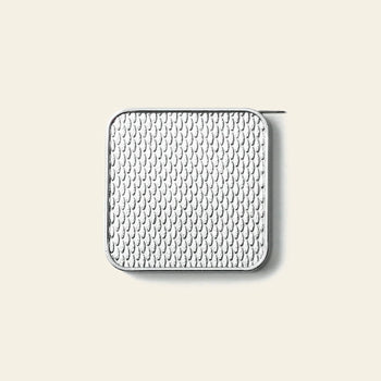 The Penco Pocket Measure by Penco is a compact tape measure with a square, silver body, rounded corners, and a textured teardrop pattern on its surface, shown against a plain beige background.