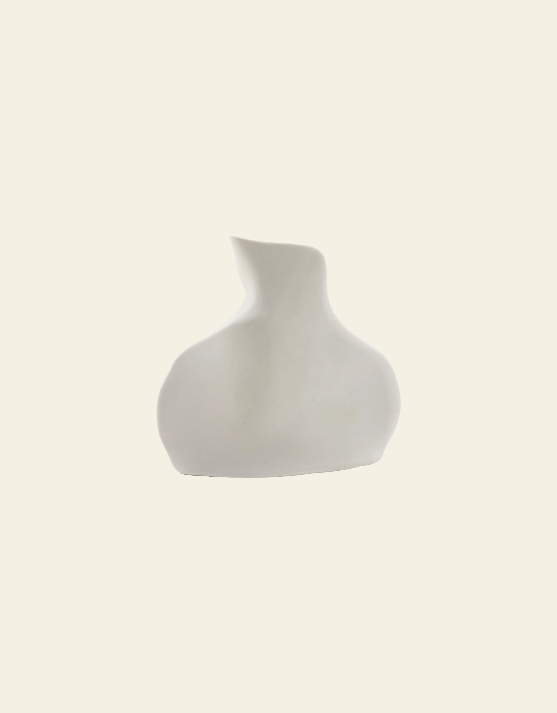 The Serax Perfect Imperfection Flower Vase N°5 in white features a minimalist abstract design with a wide base and an irregular narrow neck, set against a plain off-white background.