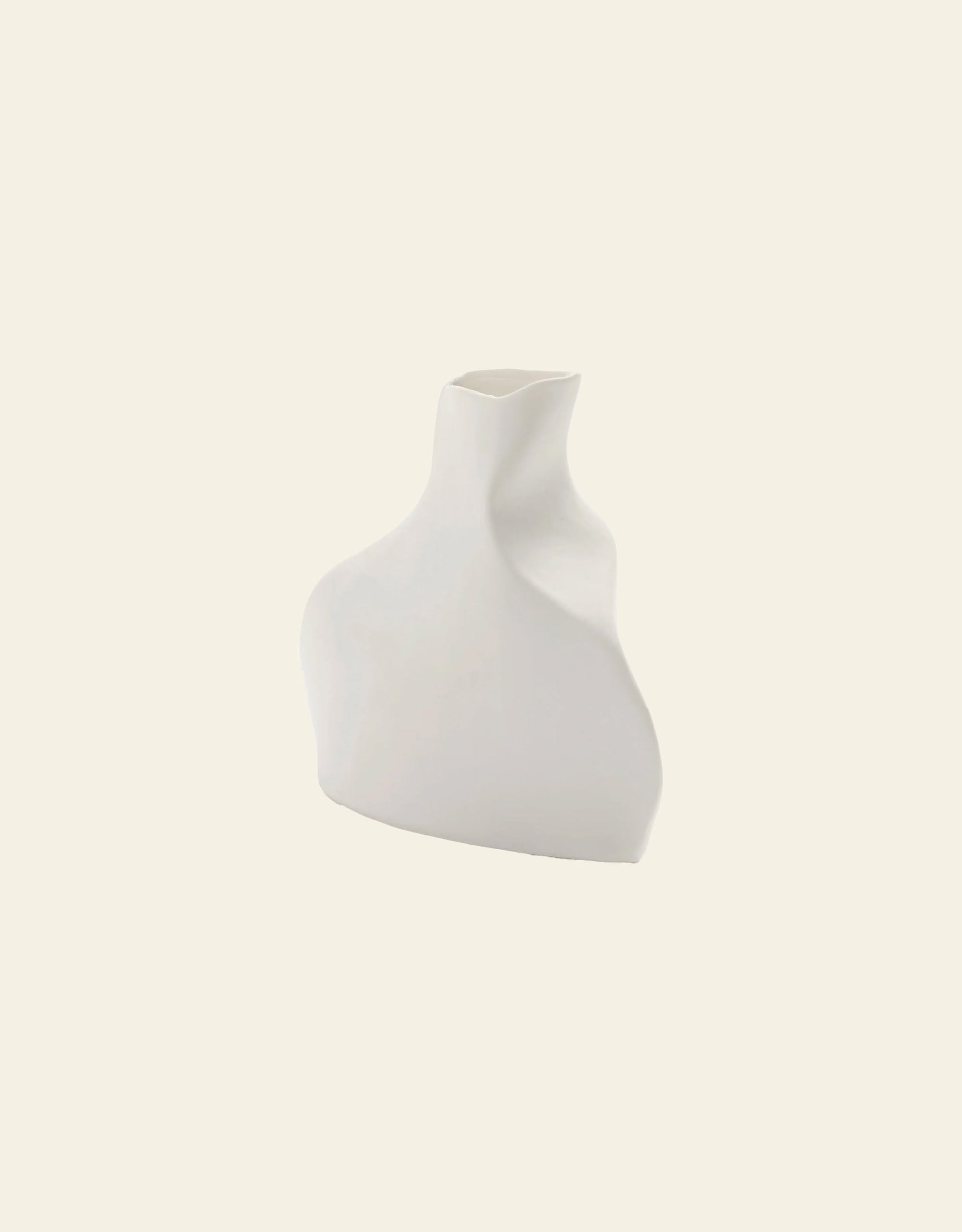 The Serax Perfect Imperfection Flower Vase N°5 in white features smooth, asymmetrical curves, showcased against a plain light beige background.