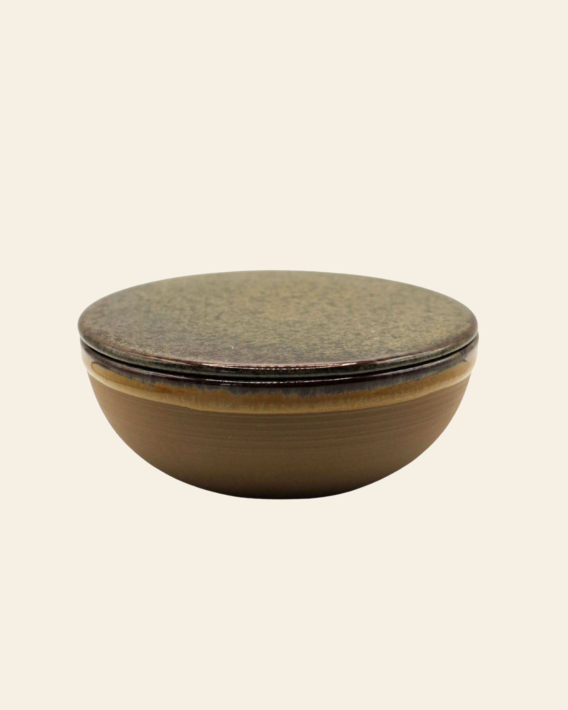 The Serax Surface Bowl & Lid in Indi Grey by Serax is a round, shallow handcrafted bowl with a matching flat lid, displayed against a plain light background.