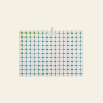 The WARMGREY TAIL Dot Check Kitchen Cloth 2 is a rectangular cream tea towel with yellow, blue, and green grid patterns and dots. Versatile and essential for any kitchen, it comes with a small label at the top center.