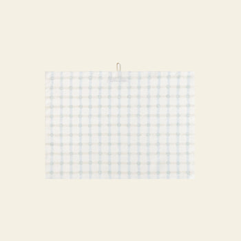 The WARMGREY TAIL Dot Check Kitchen Cloth 2 features a white base with light blue and grey plaid, hanging by a small top loop against a beige background—an elegant, versatile kitchen accessory from WARMGREY TAIL for any home.