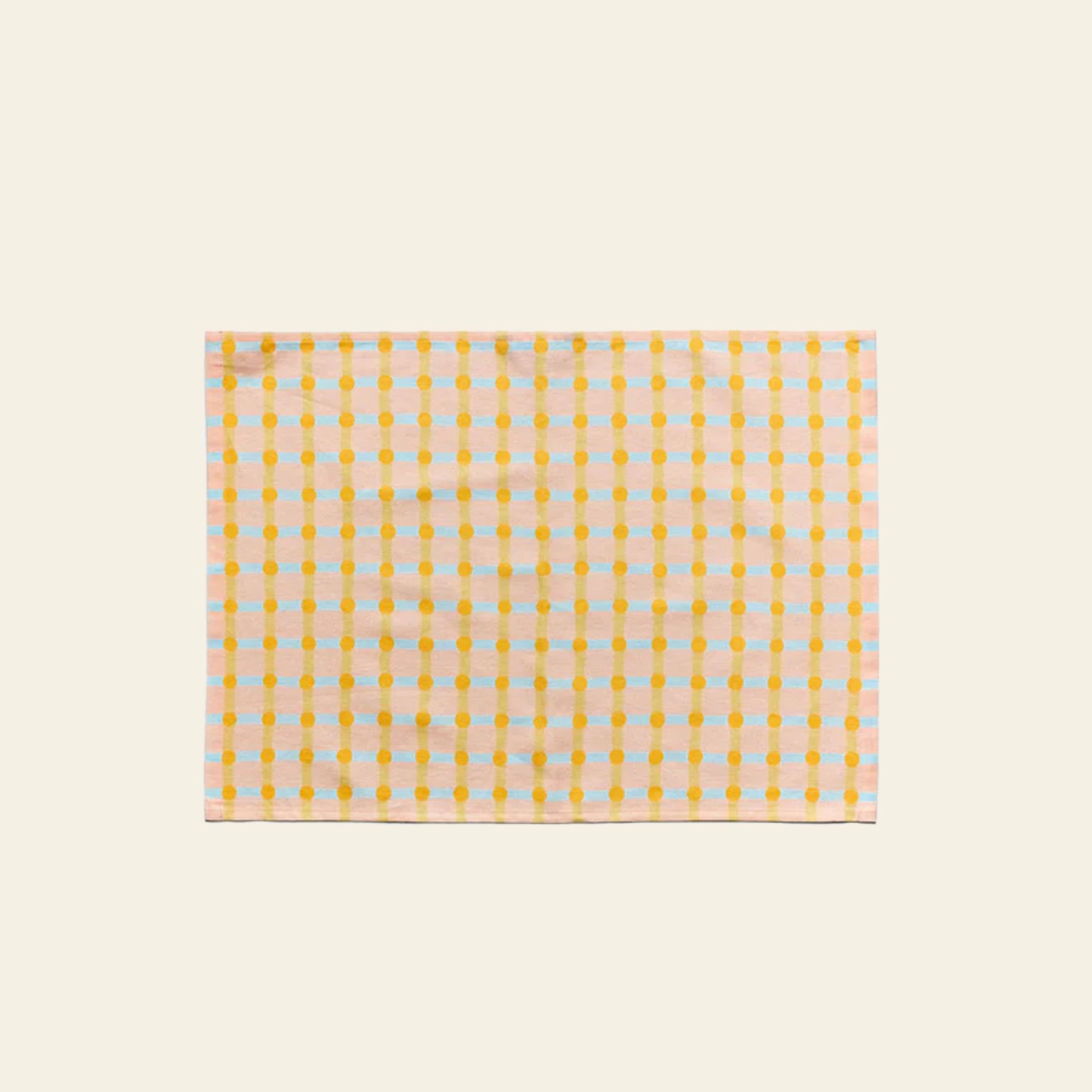 The WARMGREY TAIL Dot Check Kitchen Cloth 2 is a soft cotton cloth with yellow dots and orange lines in a grid pattern on a light background, shown flat on an off-white surface.