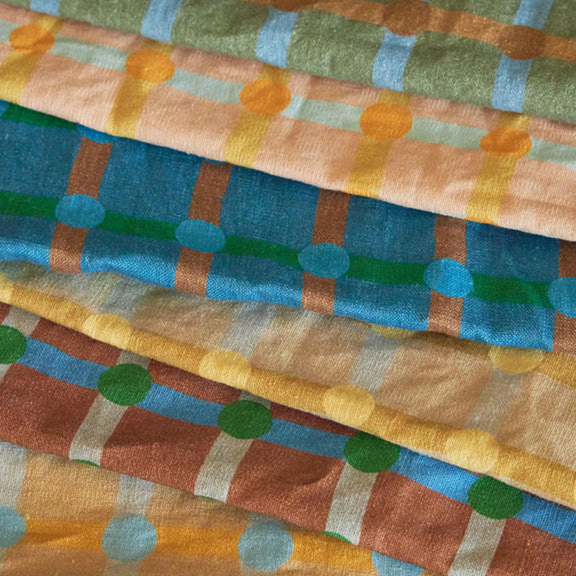 Add a pop of style to your kitchen with the WARMGREY TAIL Dot Check Kitchen Cloth 2—soft cotton fabrics in green, blue, brown, peach, and yellow featuring geometric patterns and dot check accents by WARMGREY TAIL.