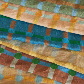 Add a pop of style to your kitchen with the WARMGREY TAIL Dot Check Kitchen Cloth 2—soft cotton fabrics in green, blue, brown, peach, and yellow featuring geometric patterns and dot check accents by WARMGREY TAIL.