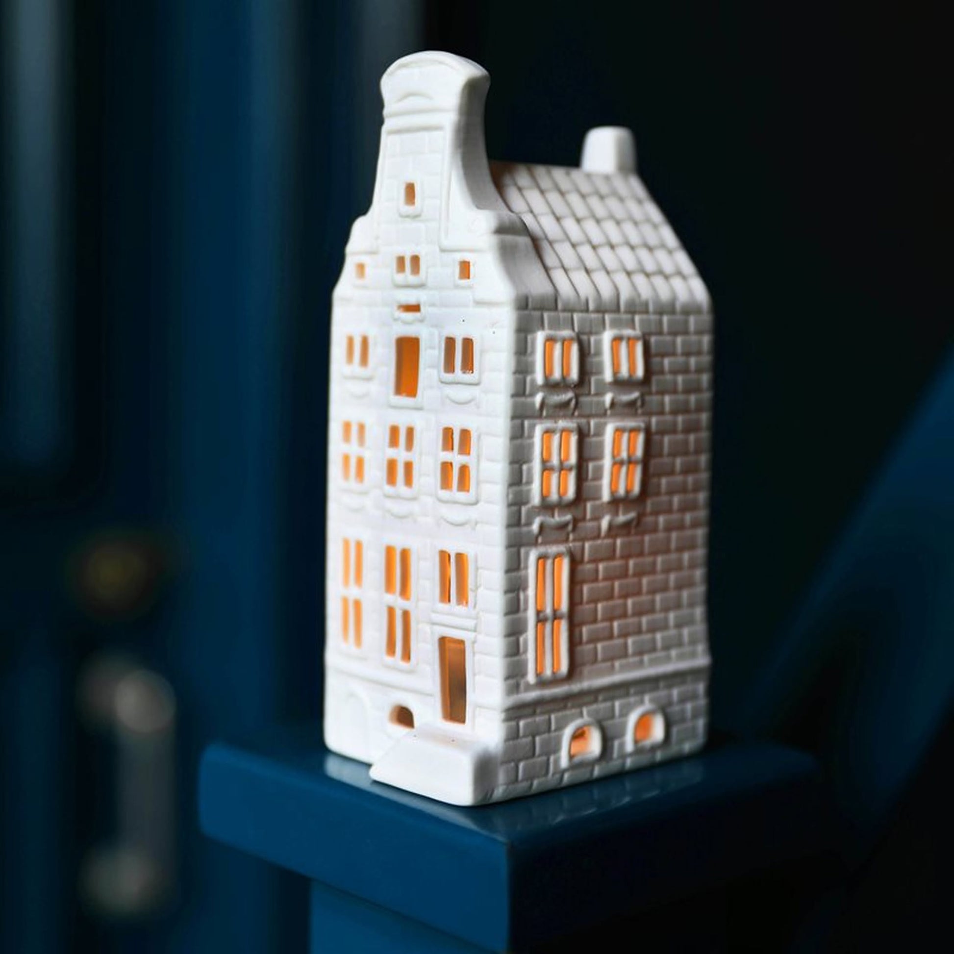 The &klevering Canal House #4 Tealight, Set of 3 by &klevering features white porcelain holders with glowing windows, ideal for Amsterdam-inspired décor and perfect for adding Dutch charm to your home.